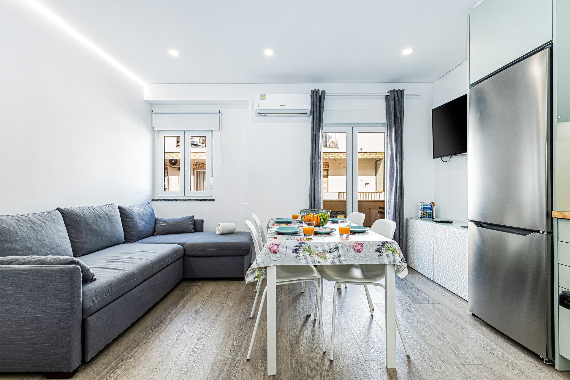 Living room with TV, fridge