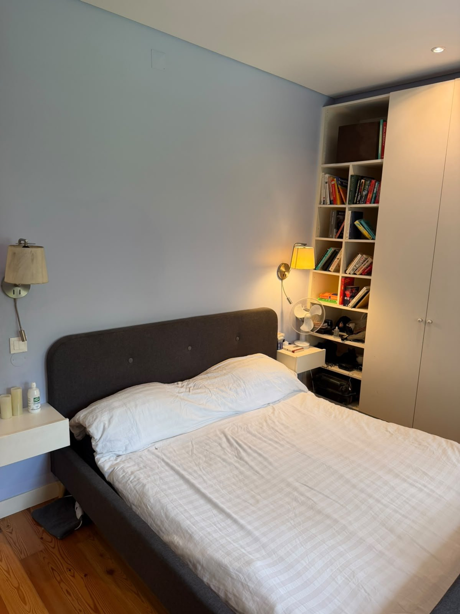 Bedroom with bookshelf and bed