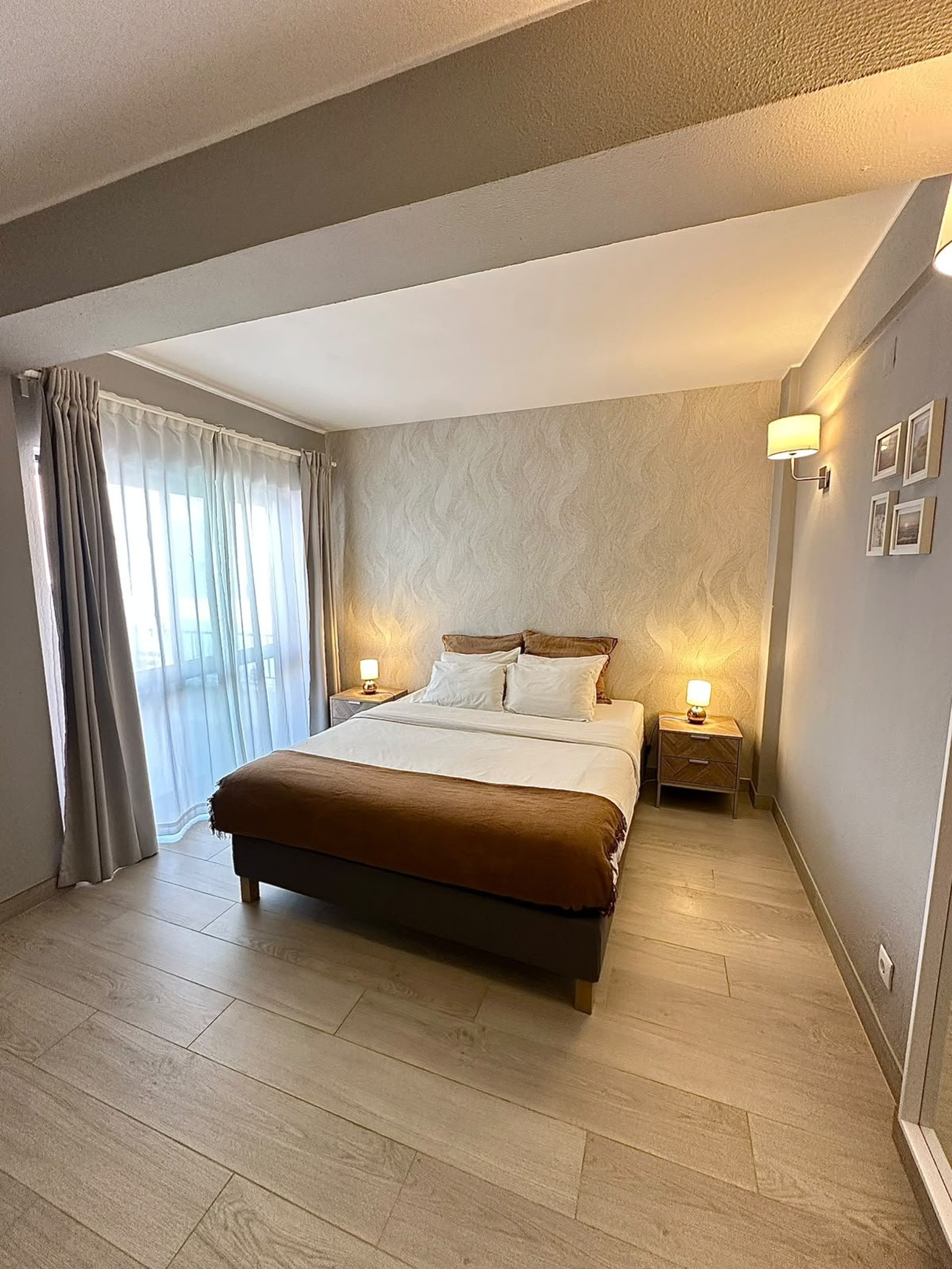Bedroom with double bed and balcony