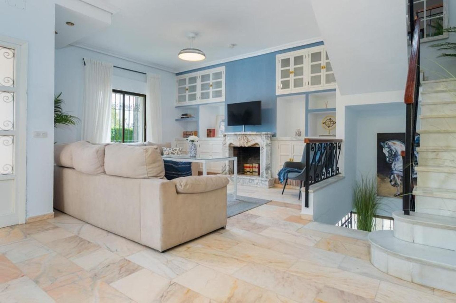 Living room with sofa, fireplace