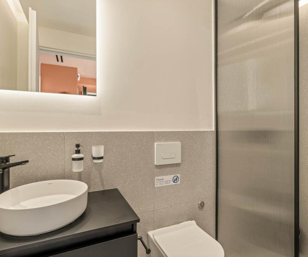 Compact bathroom with glass shower