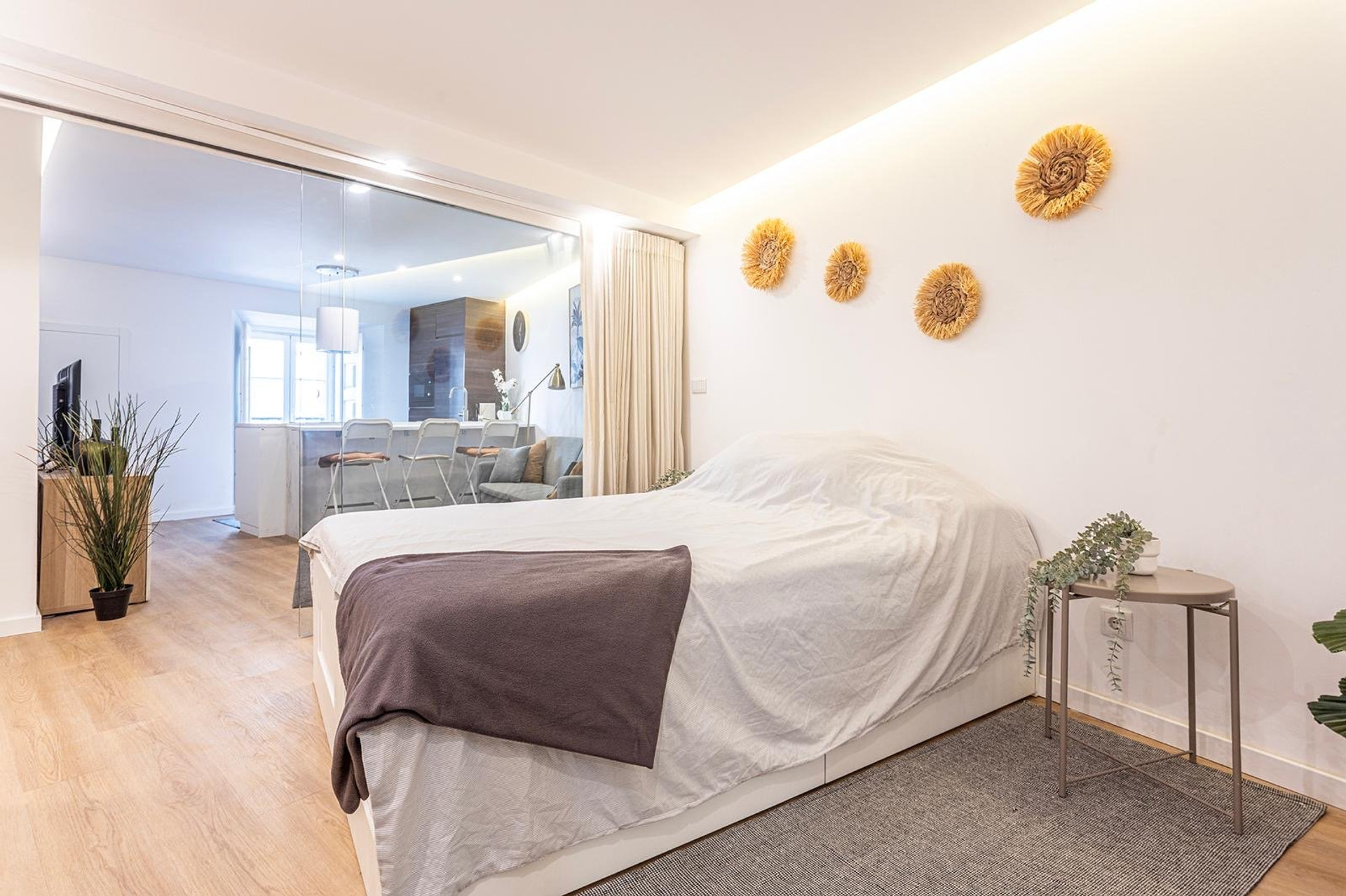 Bright bedroom with glass partition wall