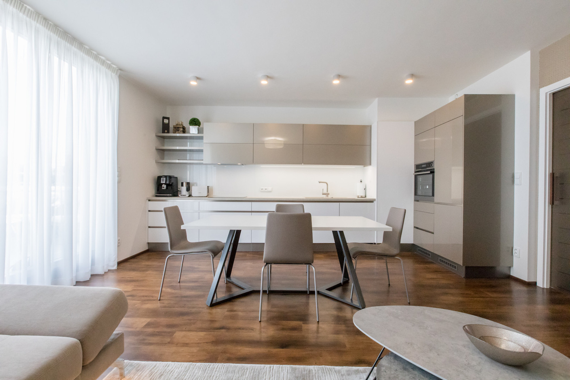 Kitchen & Living room with direct access to the terrace oriented to the South. All windows within the apartment have installed electric blinds.