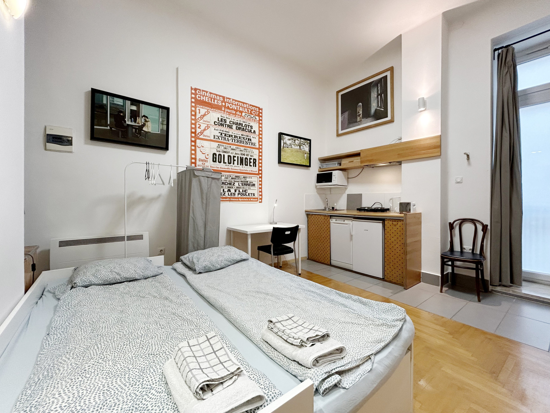 The bed from another view, with the kitchenette behind it. 