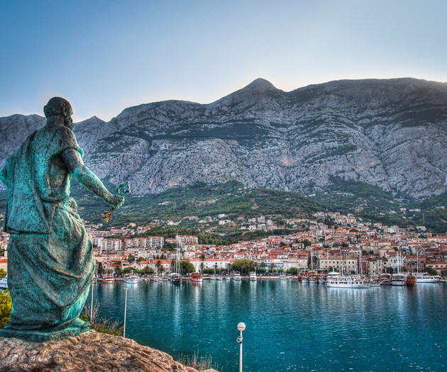 Statue overlooking coastal town