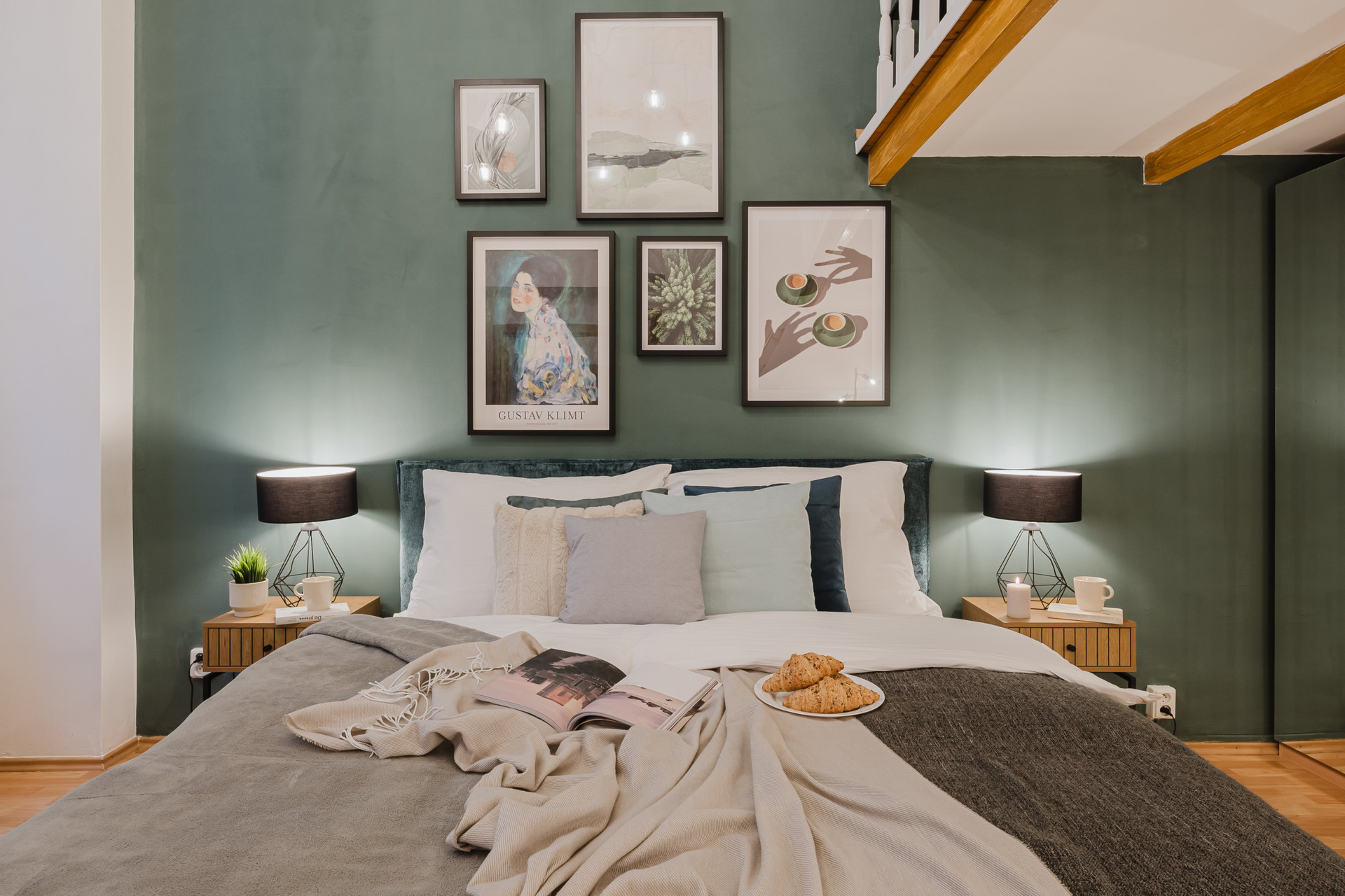 Green bedroom with gallery wall