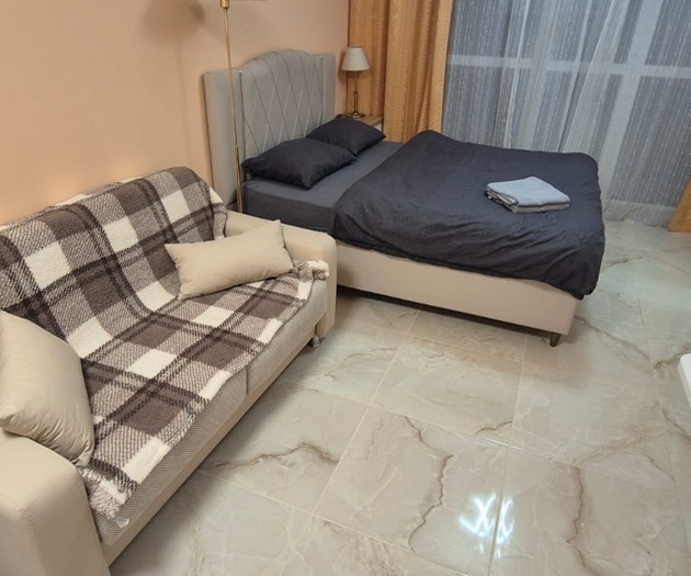 Light studio with balcony close to sea and center