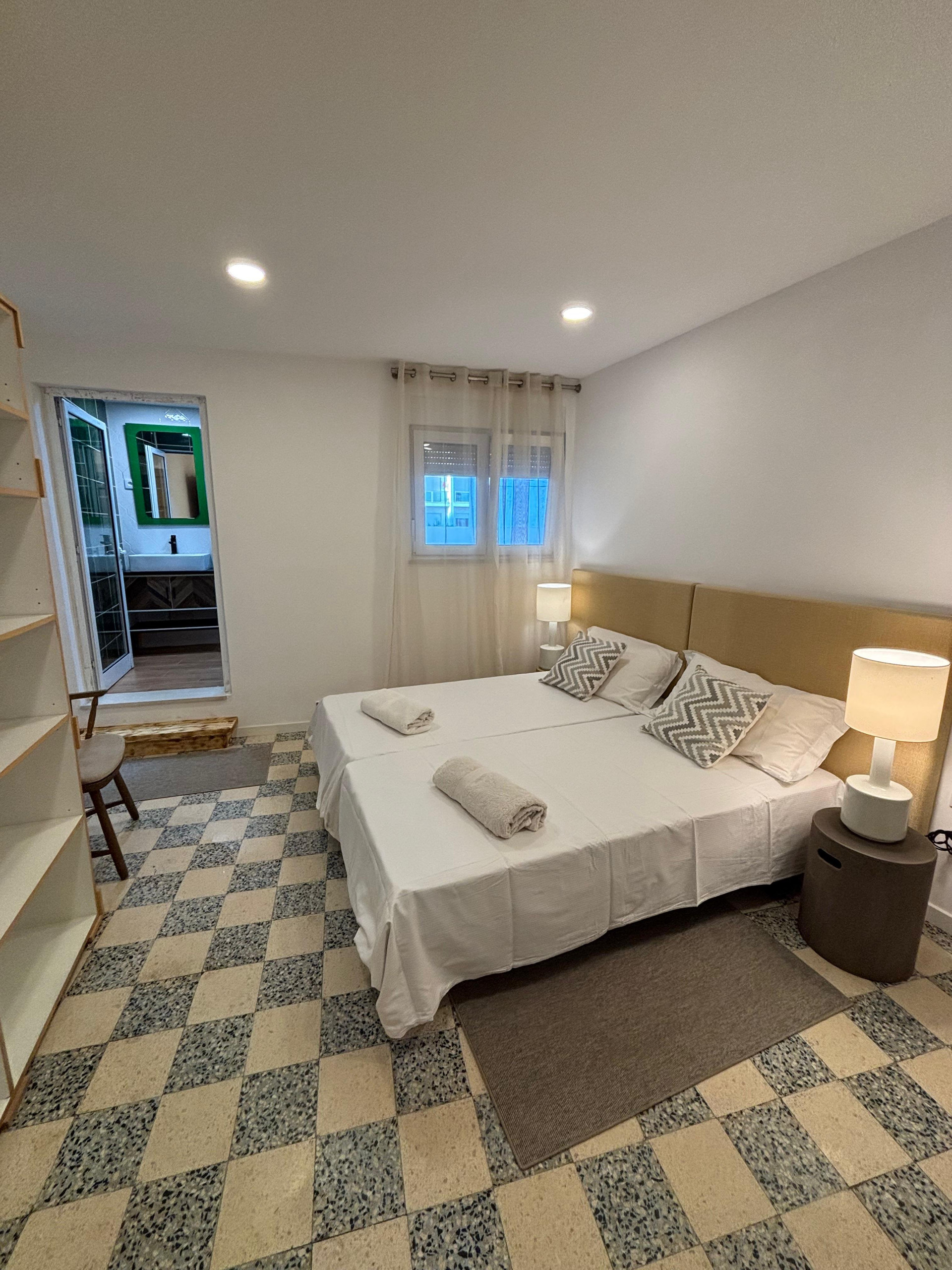 Bedroom with tiled floor and ensuite