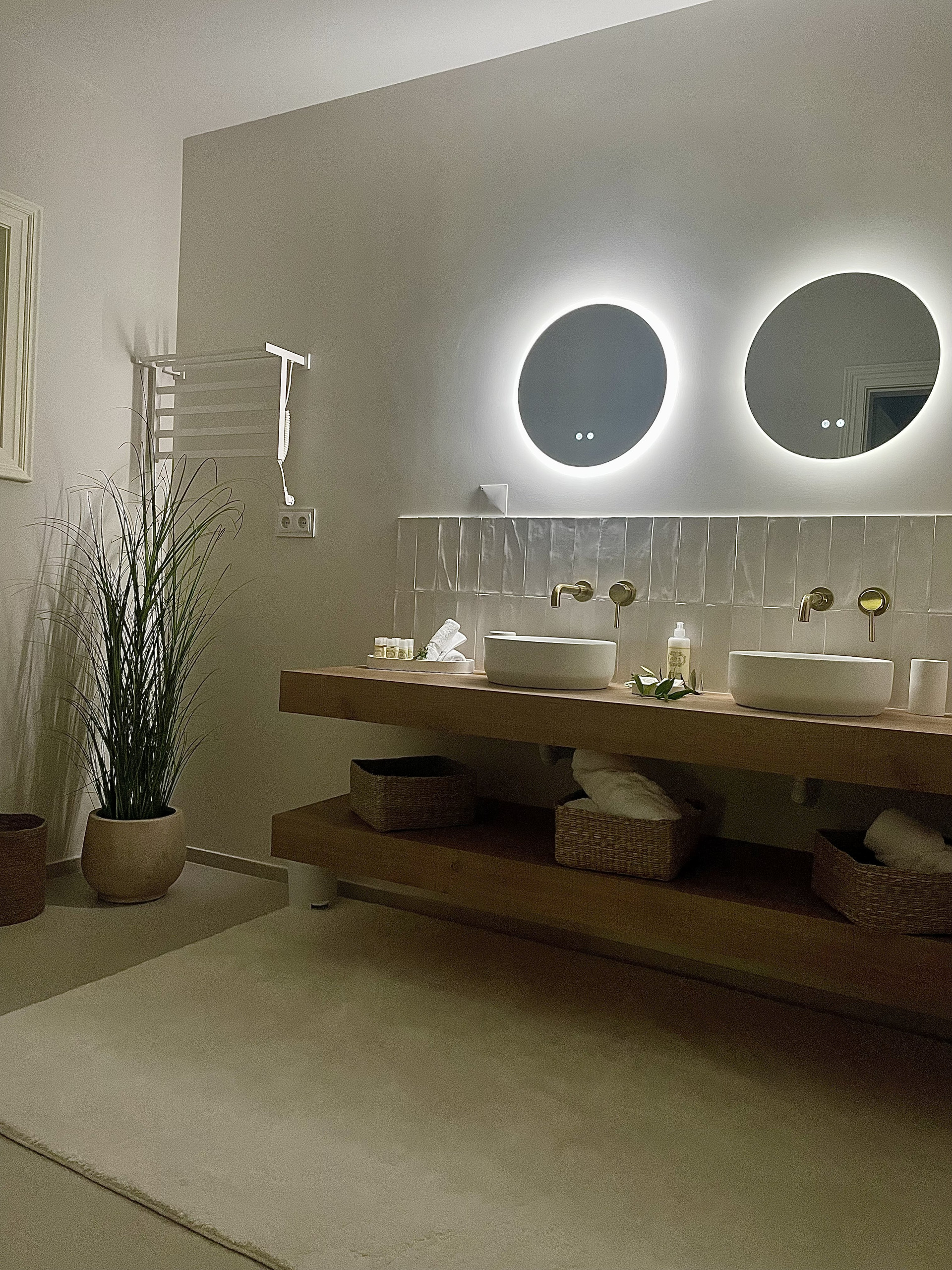 Elegant bathroom with double sink and large shower