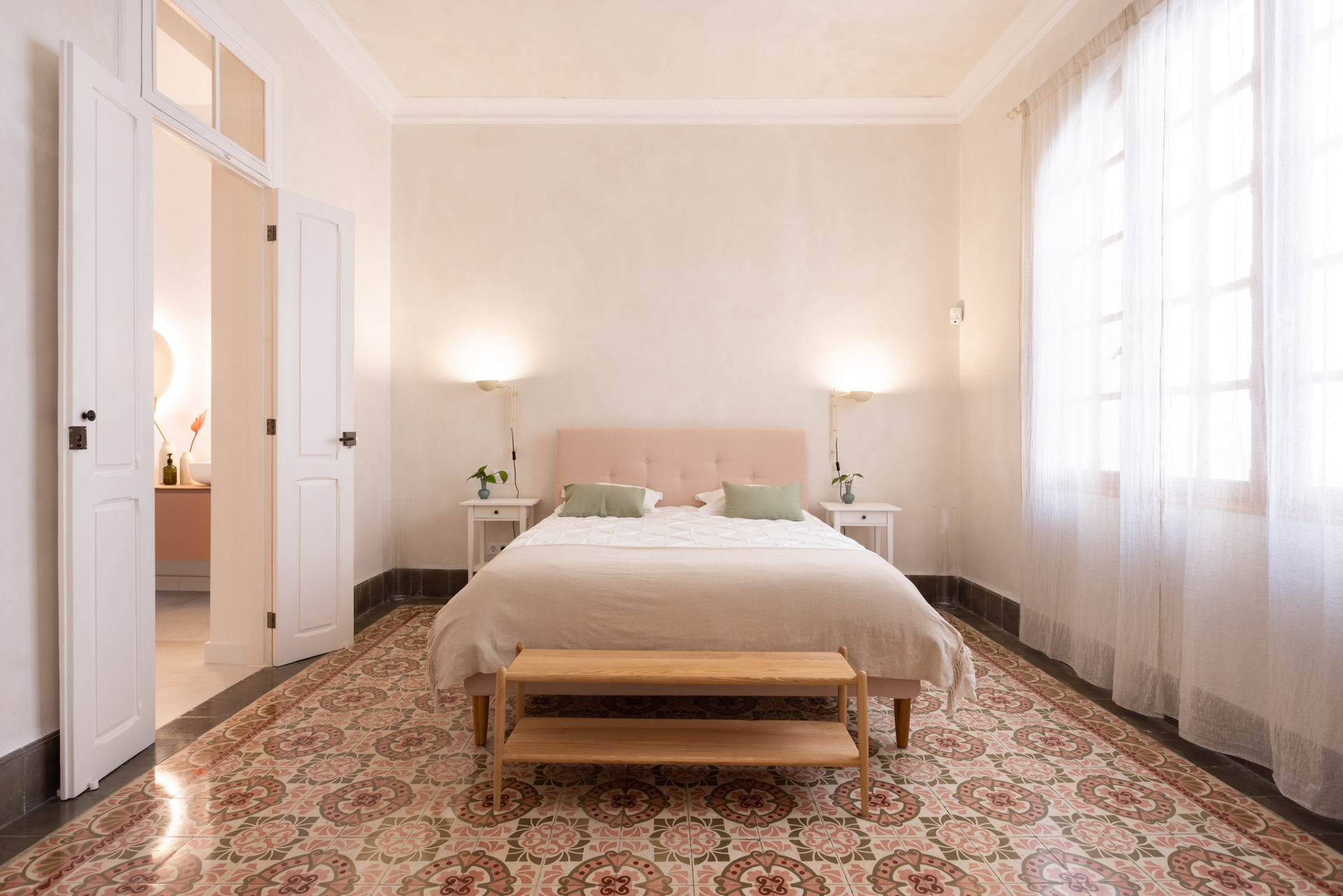 Elegant bedroom with patterned tile floor