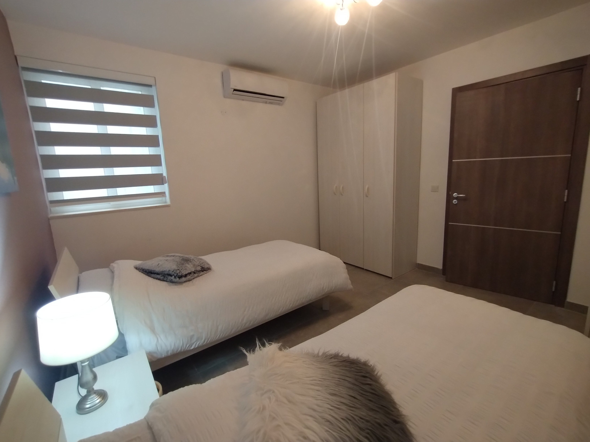 Bedroom with twin beds and wardrobe