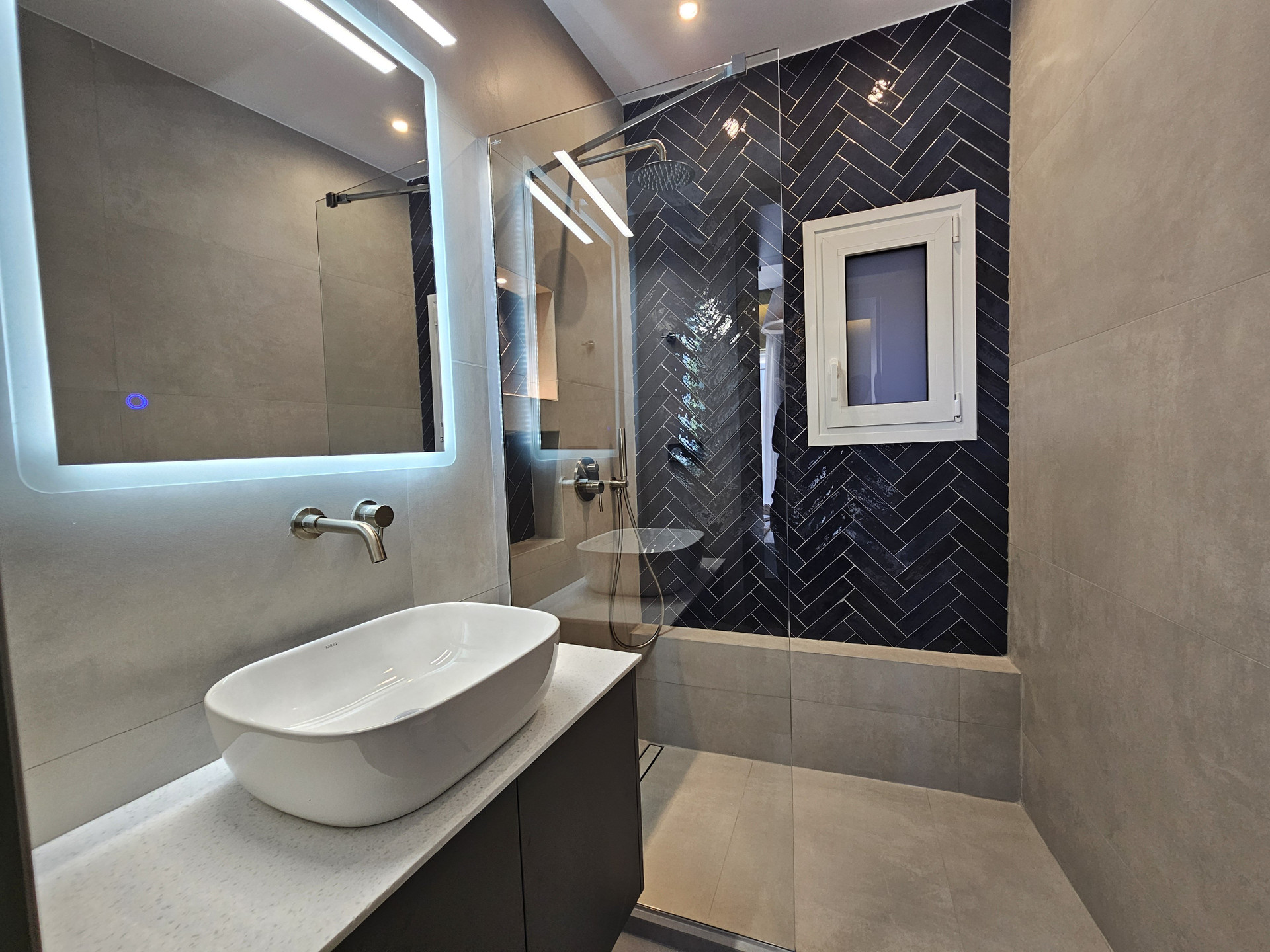 Bathroom with herringbone tile shower
