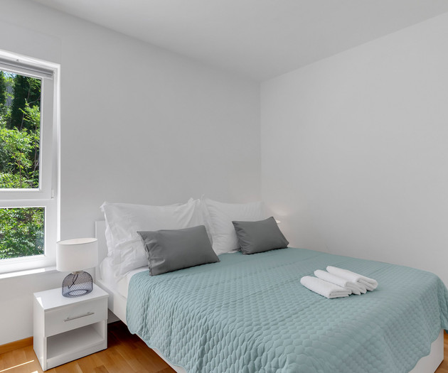 Bedroom with garden view window