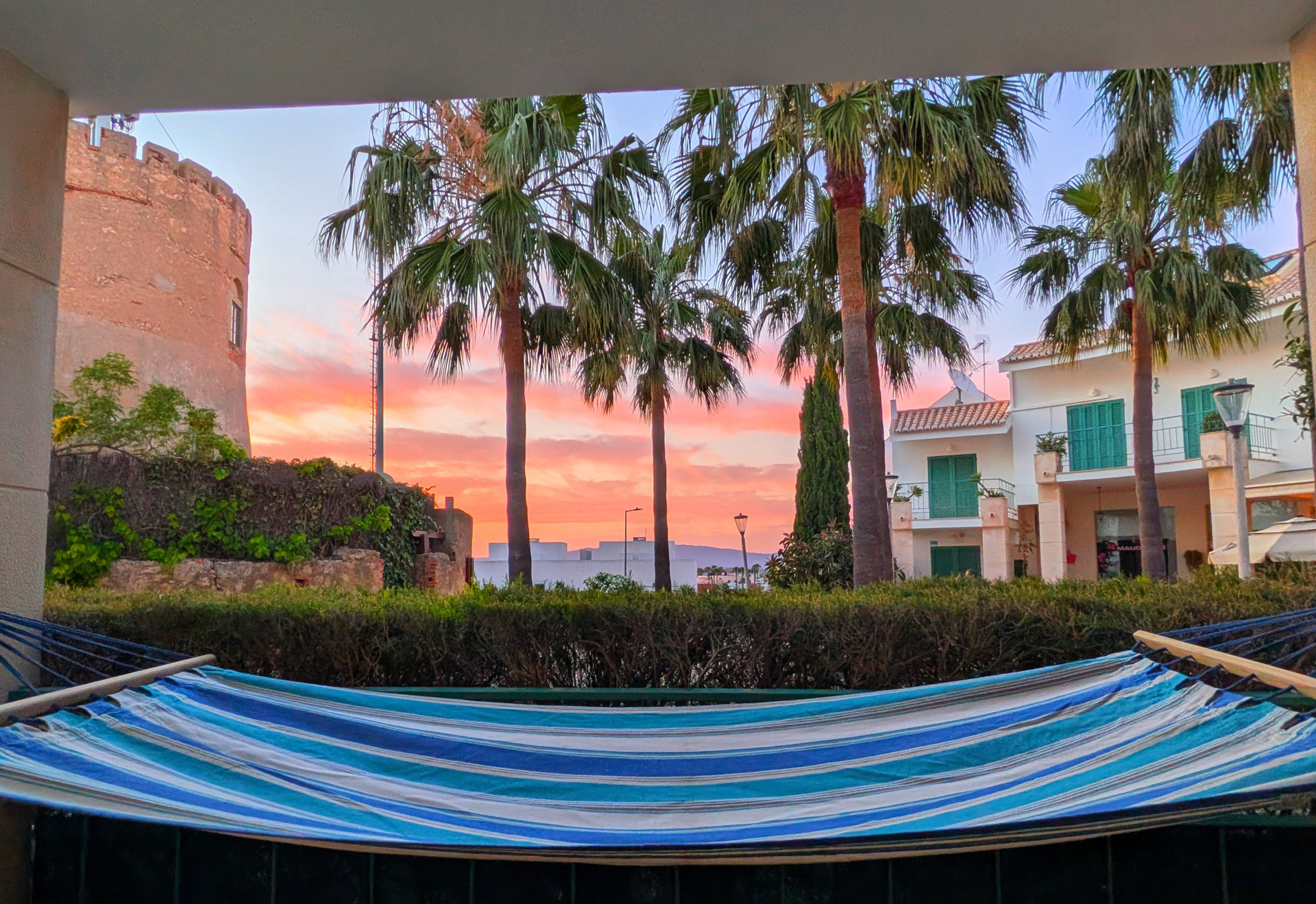 Balcony hammock sunset castle view