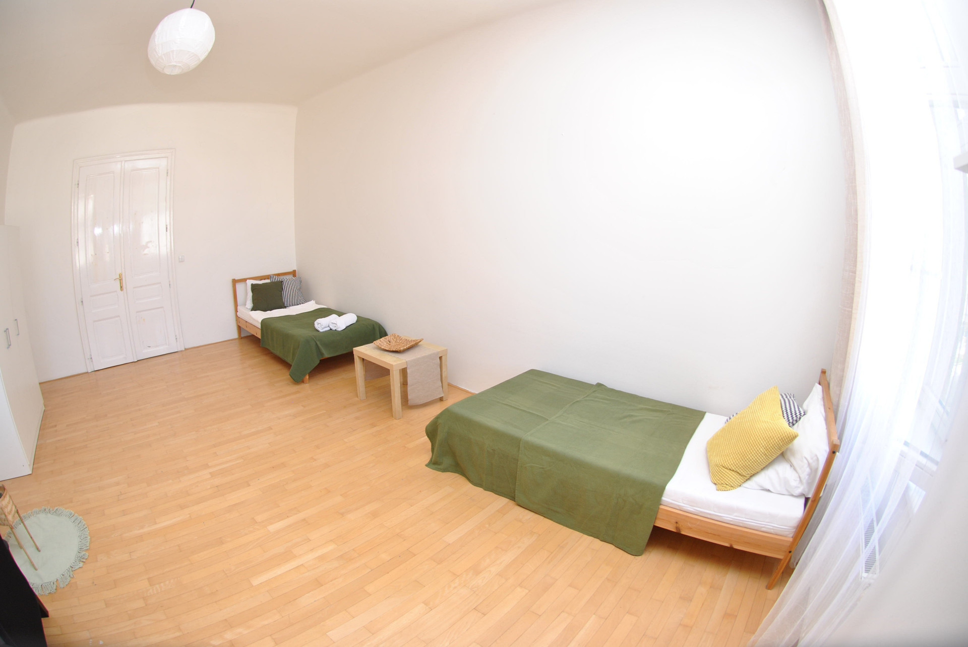 Spacious bedroom with two single beds
