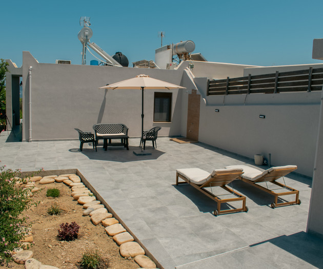 Rooftop patio with loungers