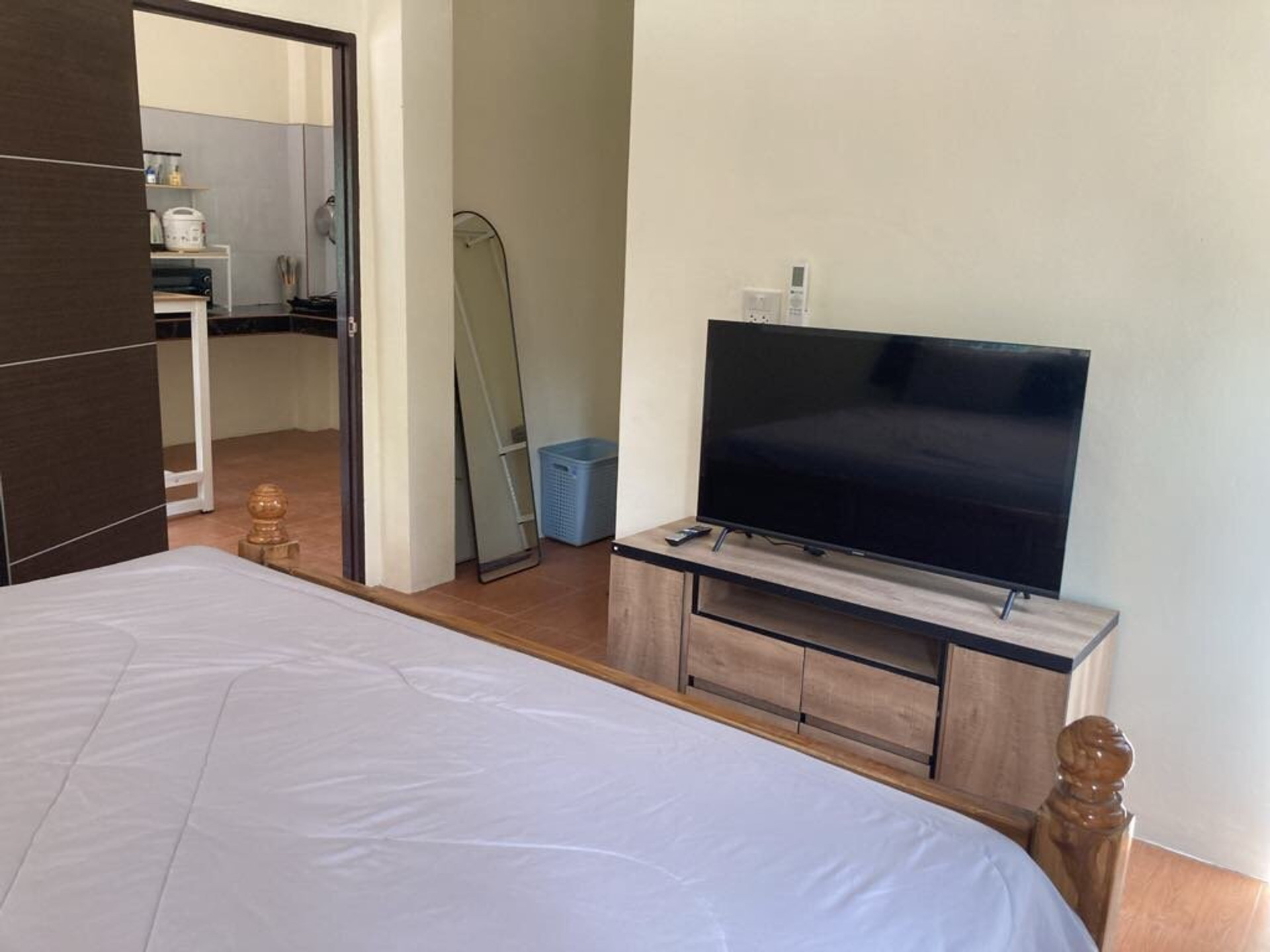 Bedroom with TV and mirror