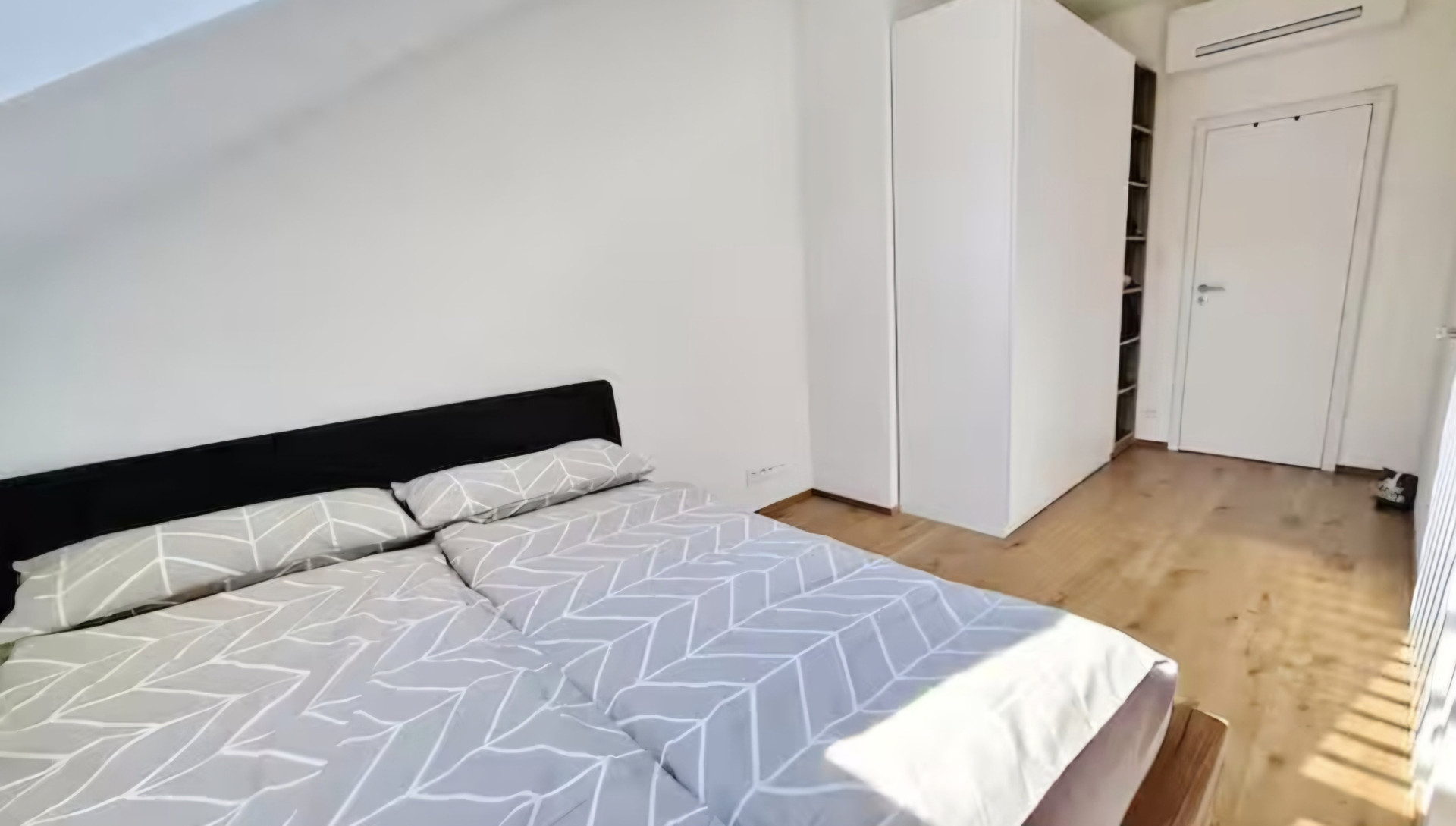 Bedroom with wardrobe and bed