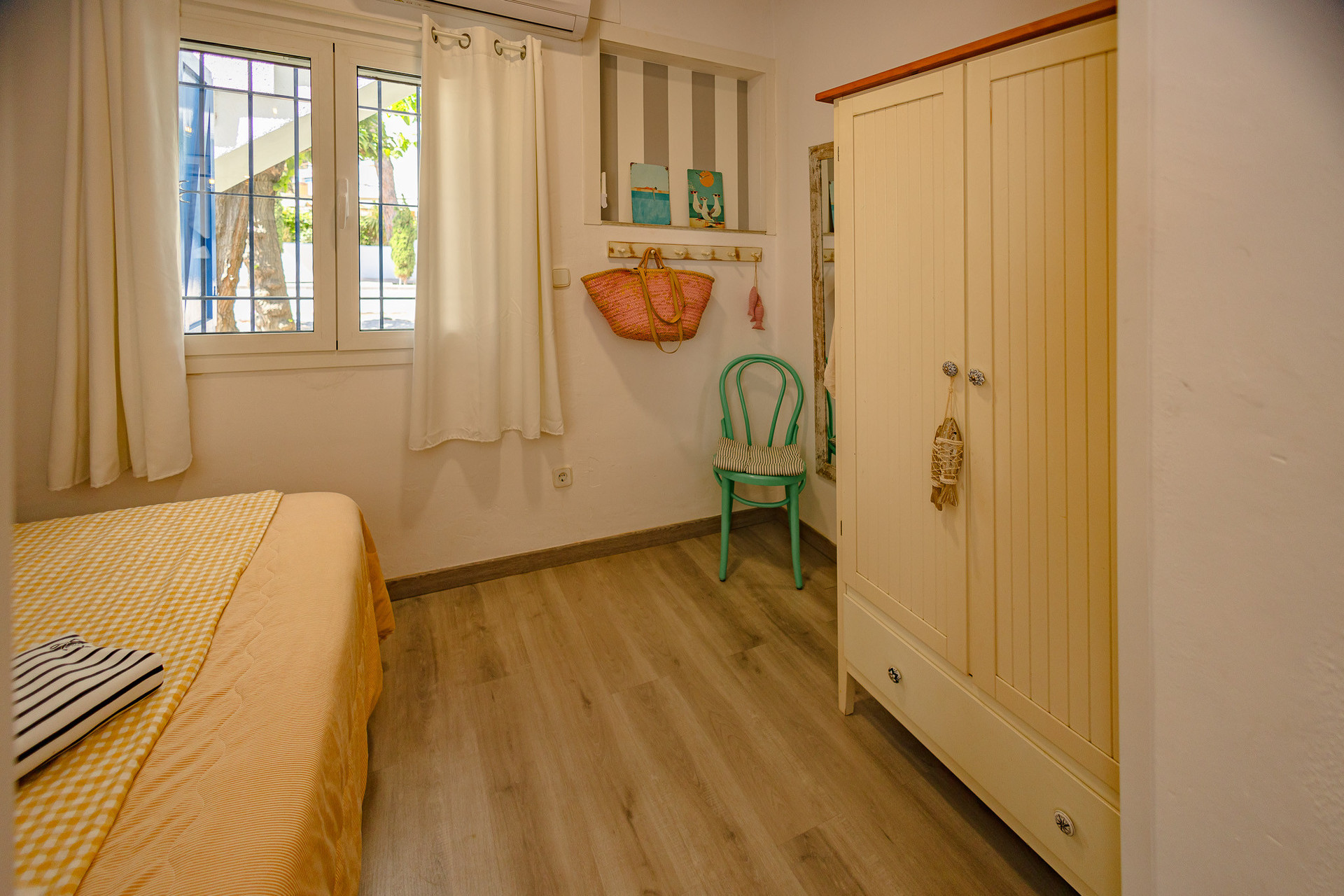 Bedroom with wardrobe and chair