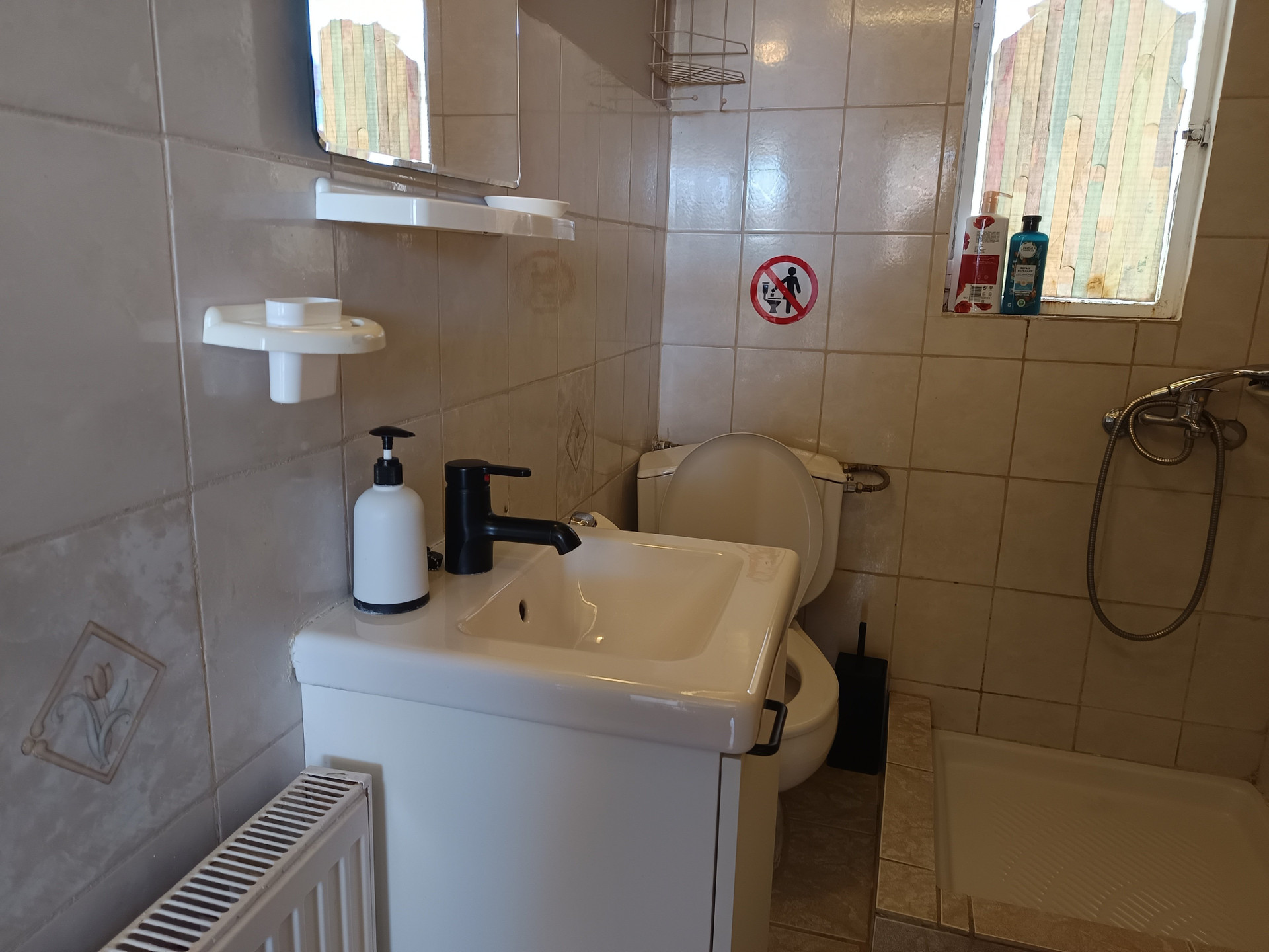 Bathroom with sink toilet shower