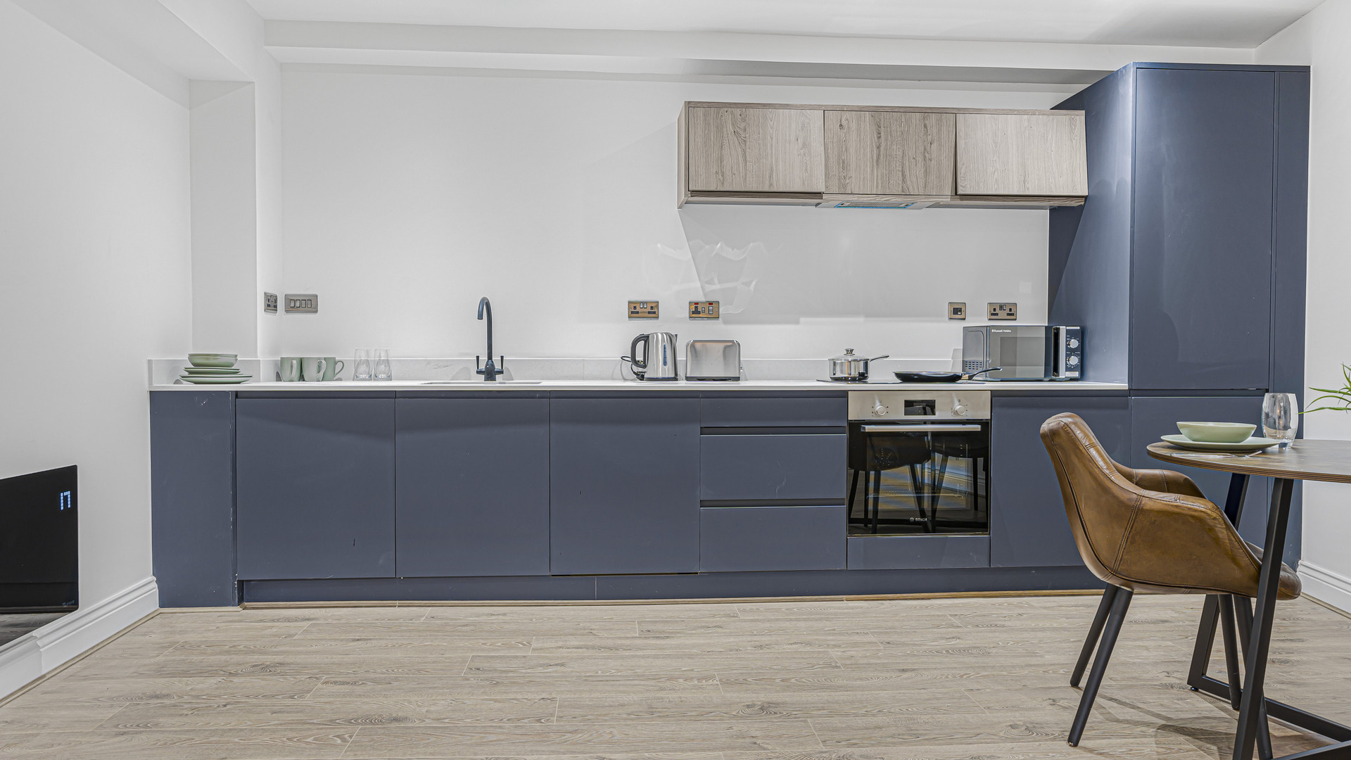 Modern navy blue fitted kitchen