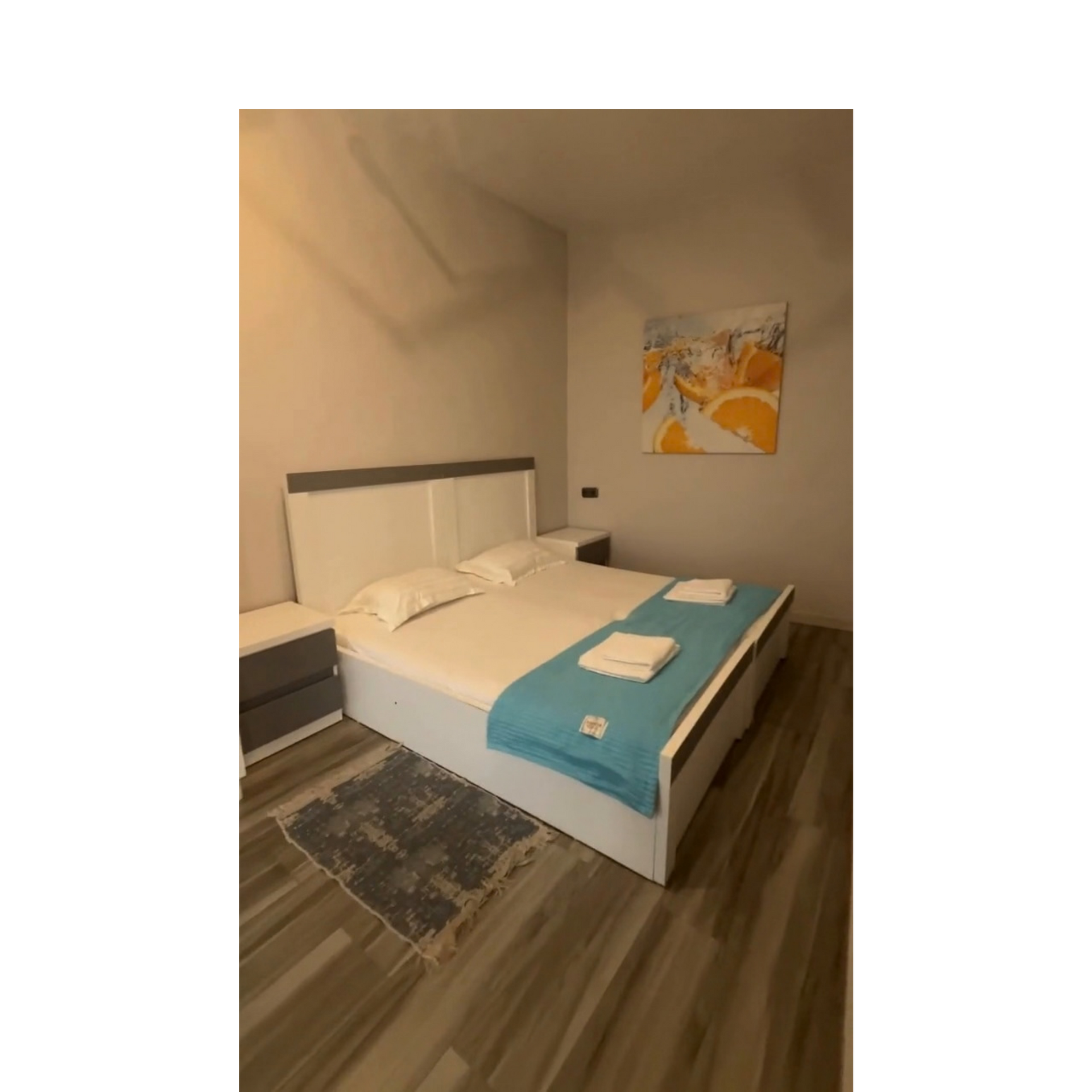 Bedroom with teal towels