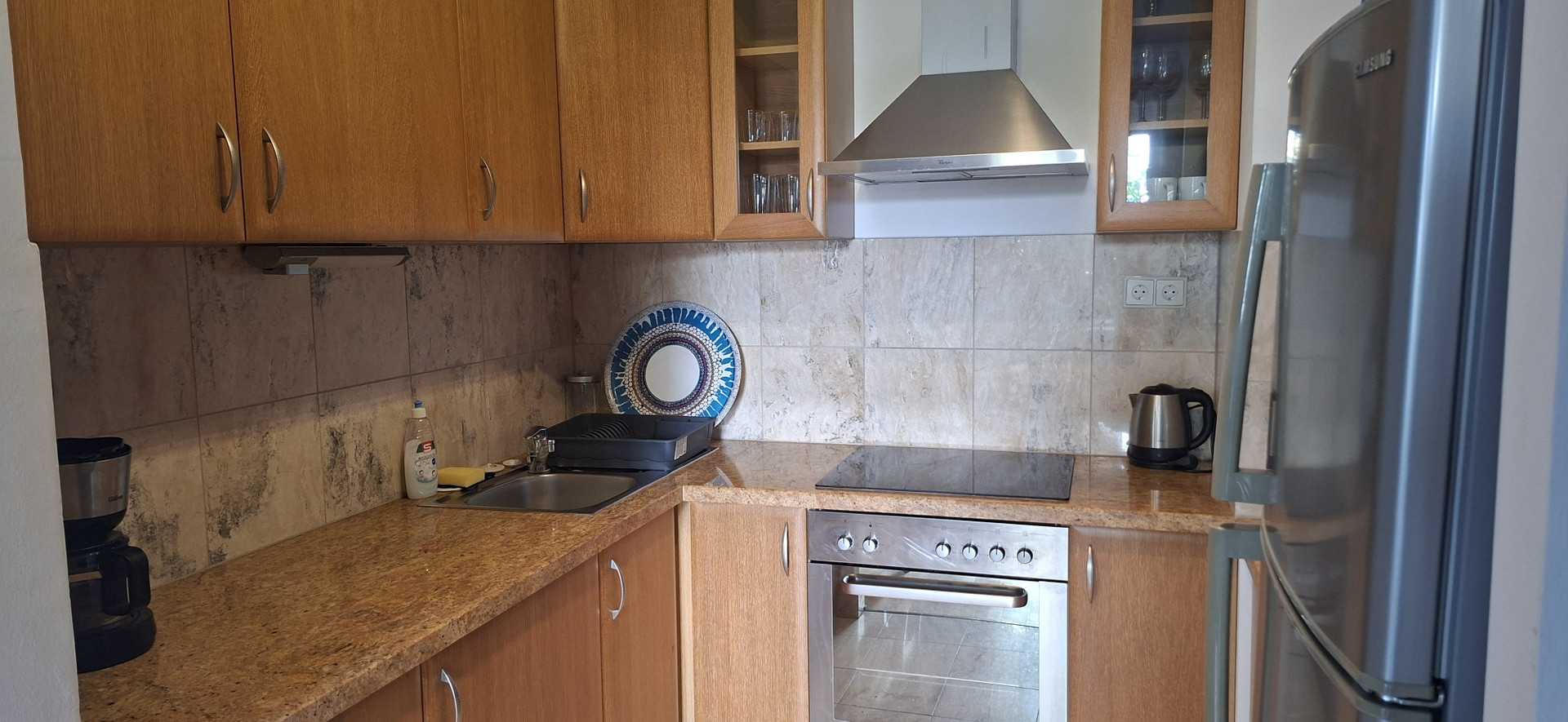 Kitchen with oven and refrigerator