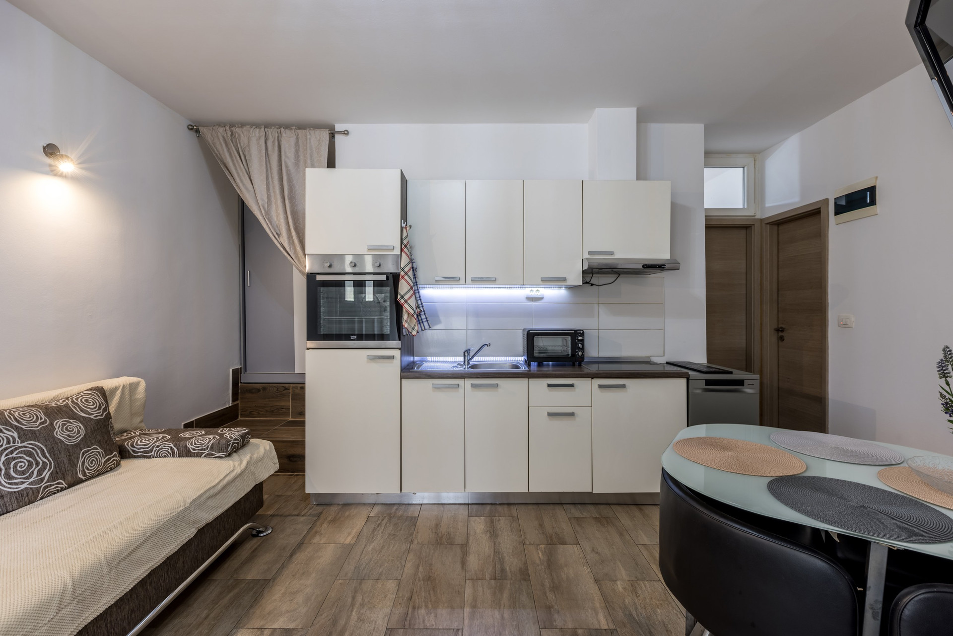 Full kitchen with dining table.