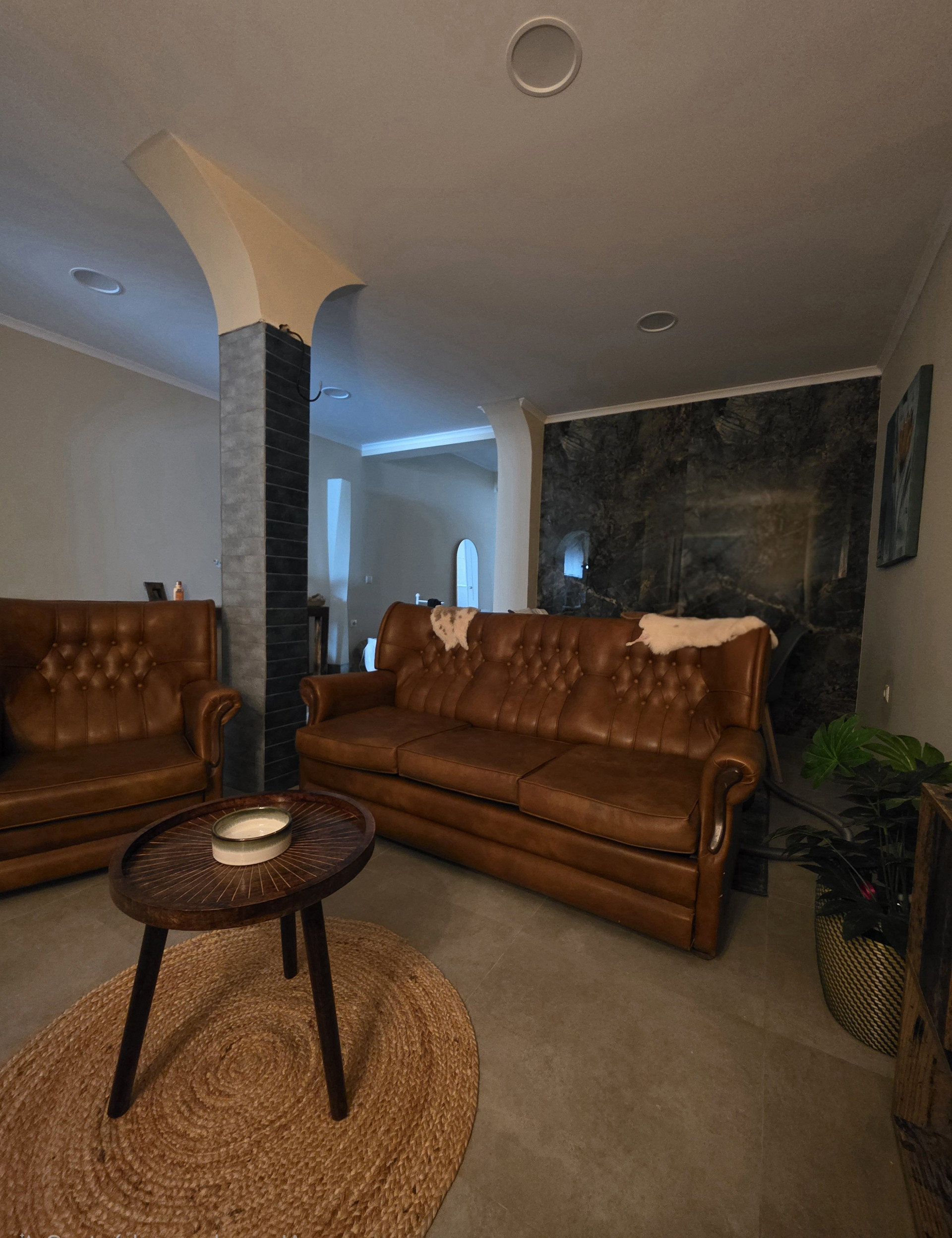 Living room with leather Chesterfield sofas
