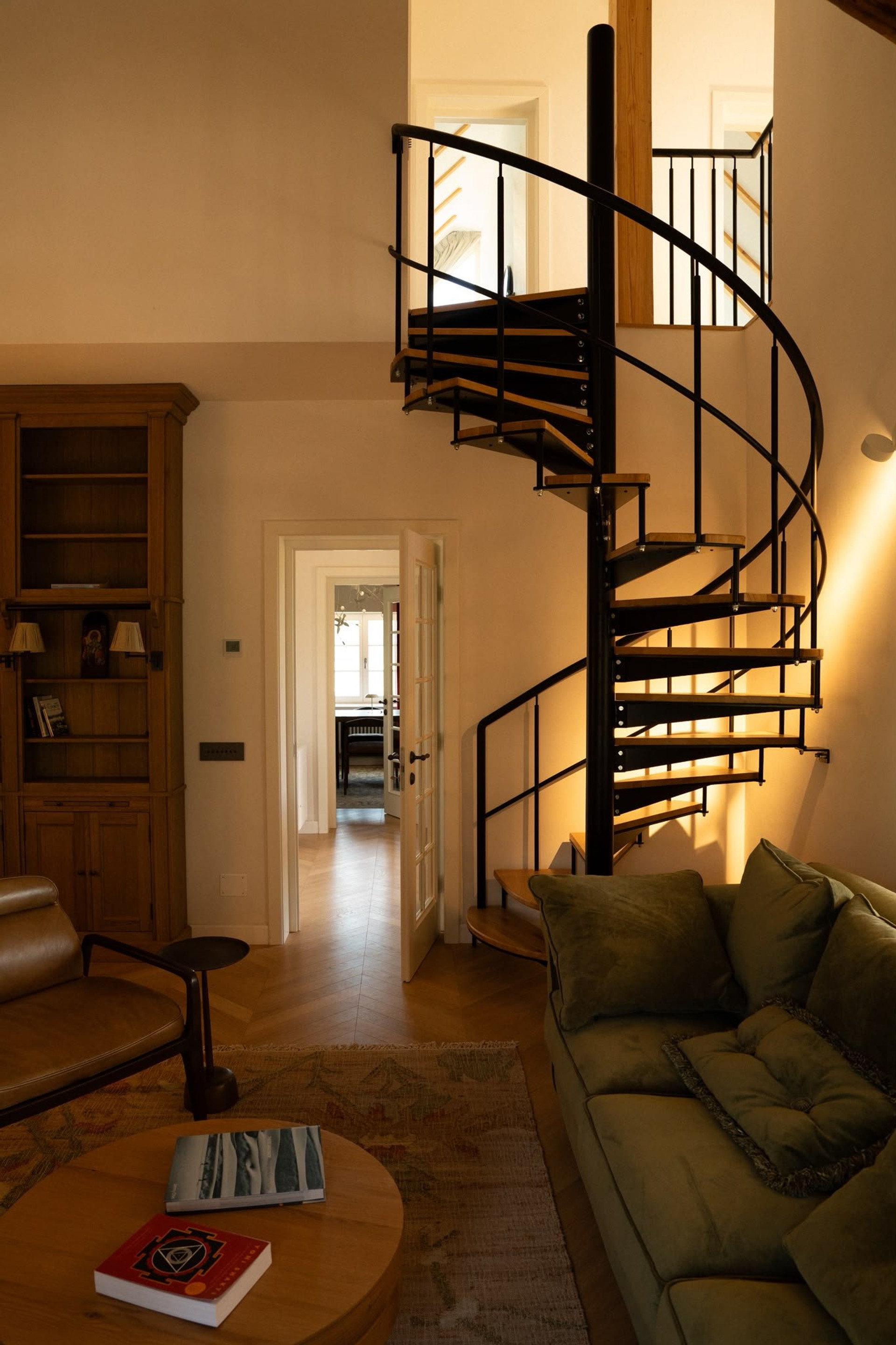 Living room with spiral staircase