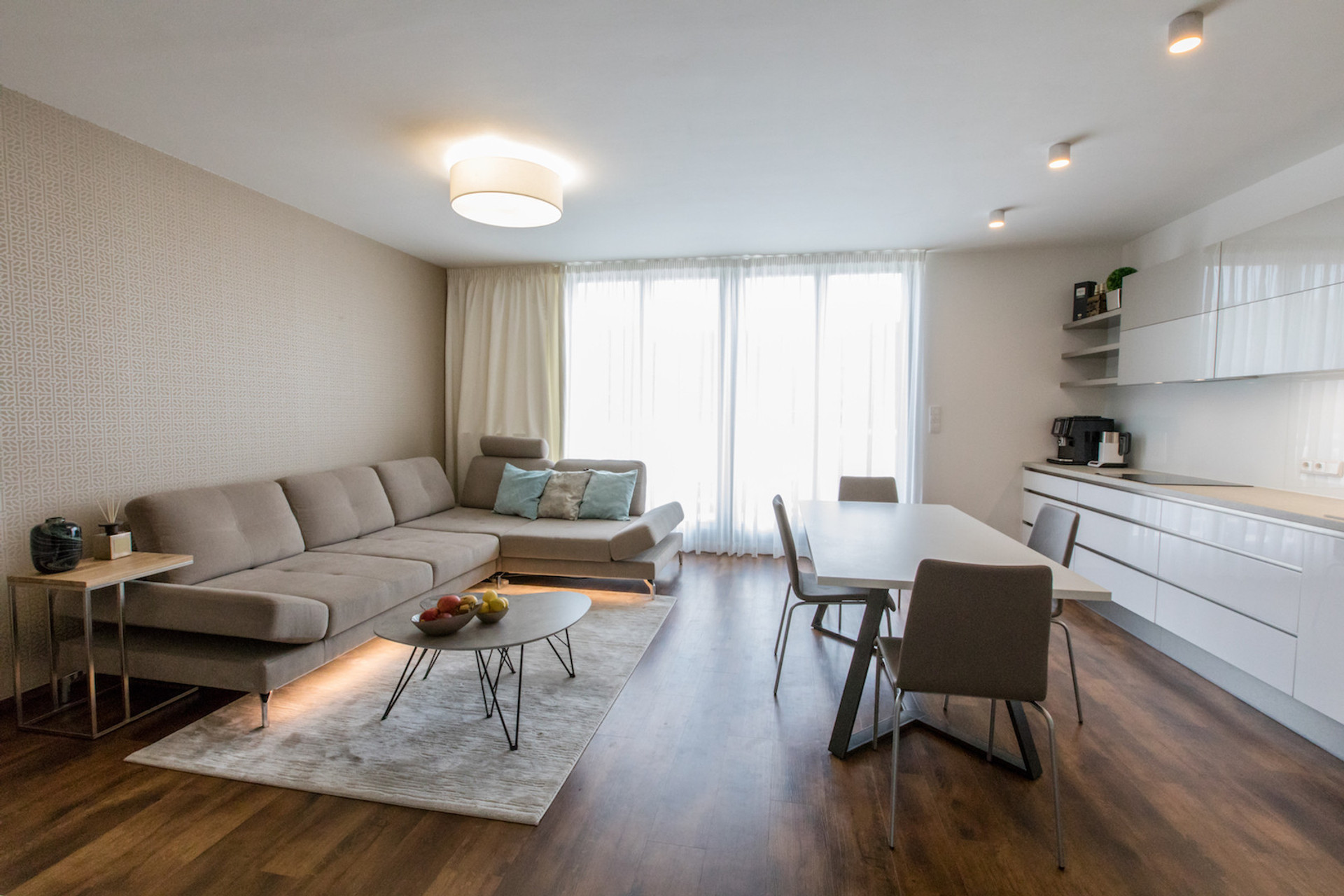 Kitchen & Living room with direct access to the terrace oriented to the South. All windows within the apartment have installed electric blinds.