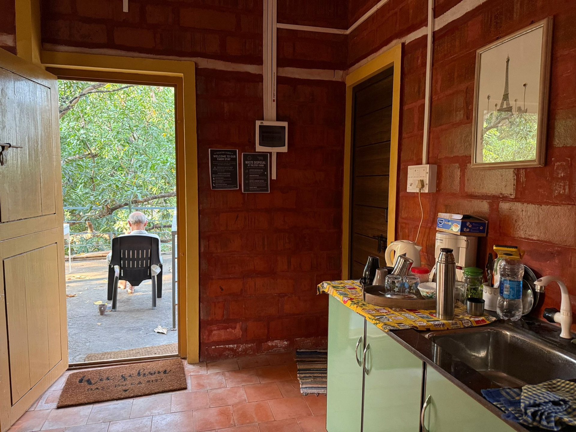 Kitchenette with sink and open door