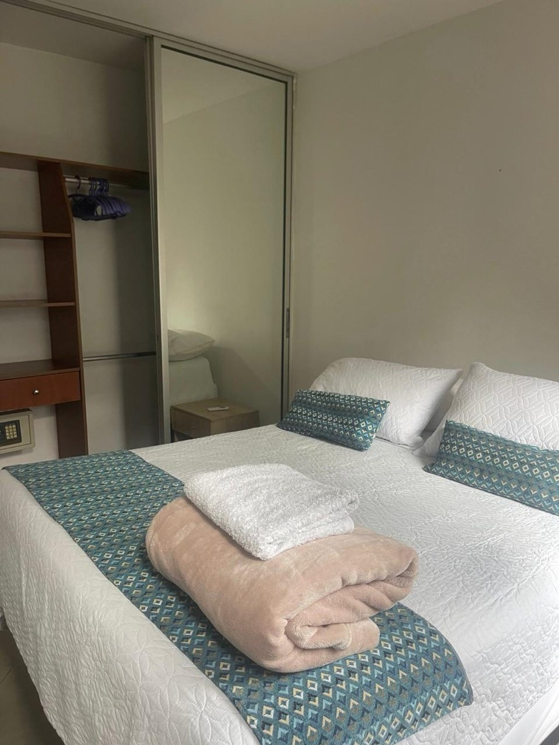 Bedroom with towels and closet