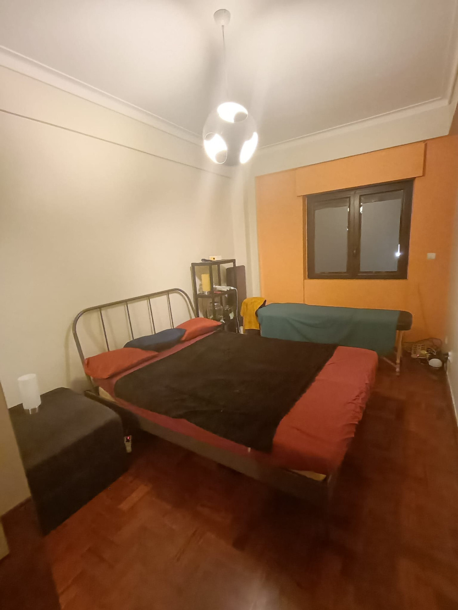 Double bed bedroom whit massage table and double door wardrobe 