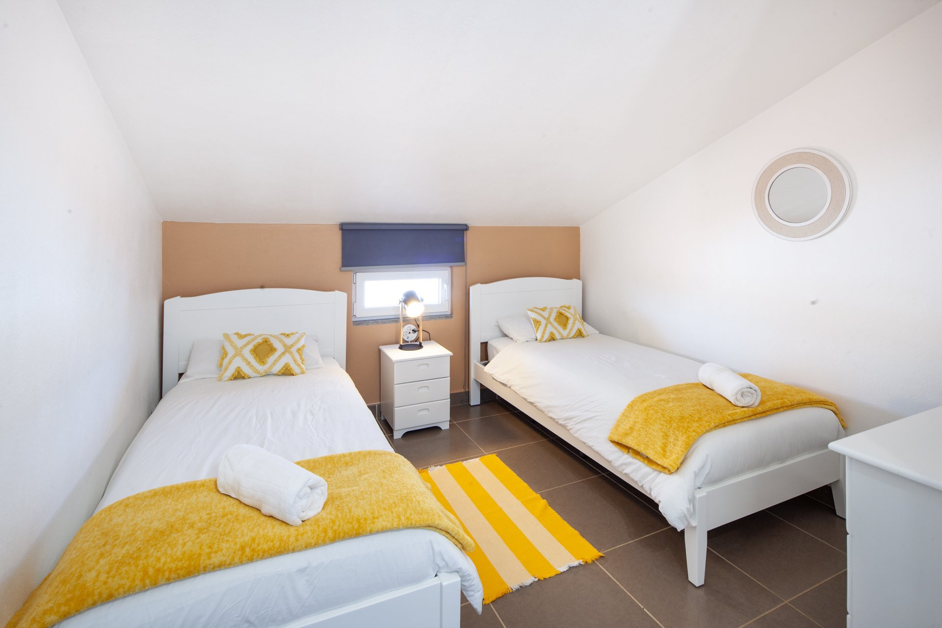 Twin bedroom with yellow accents