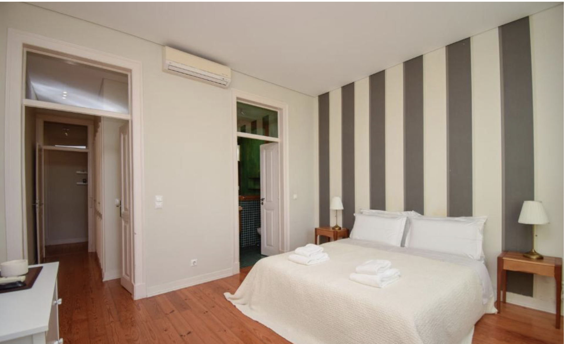 Master bedroom with striped wall