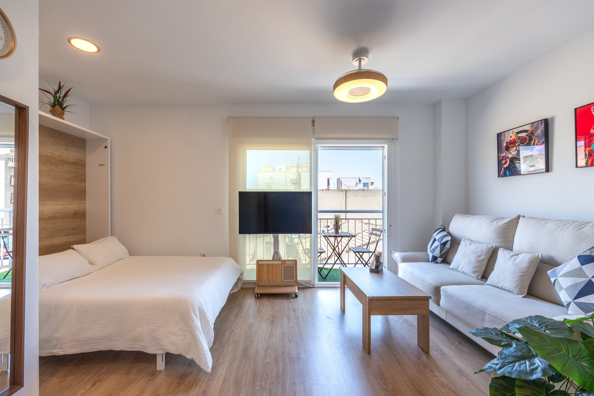Studio with bed sofa and balcony