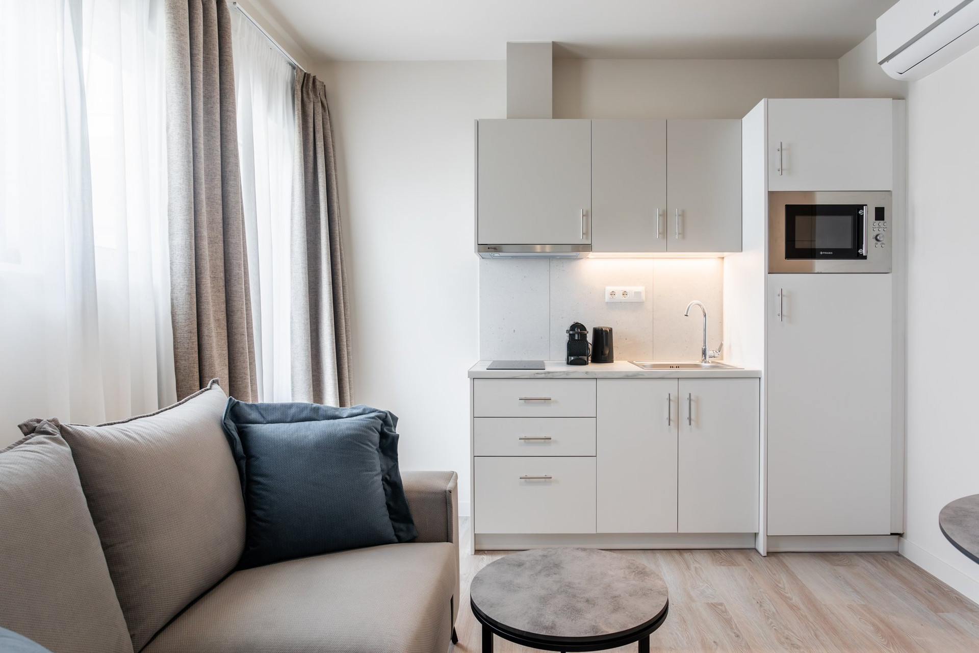 Kitchenette with sofa and appliances