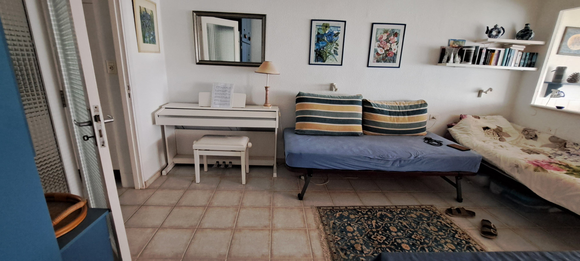 Living room with piano and daybeds