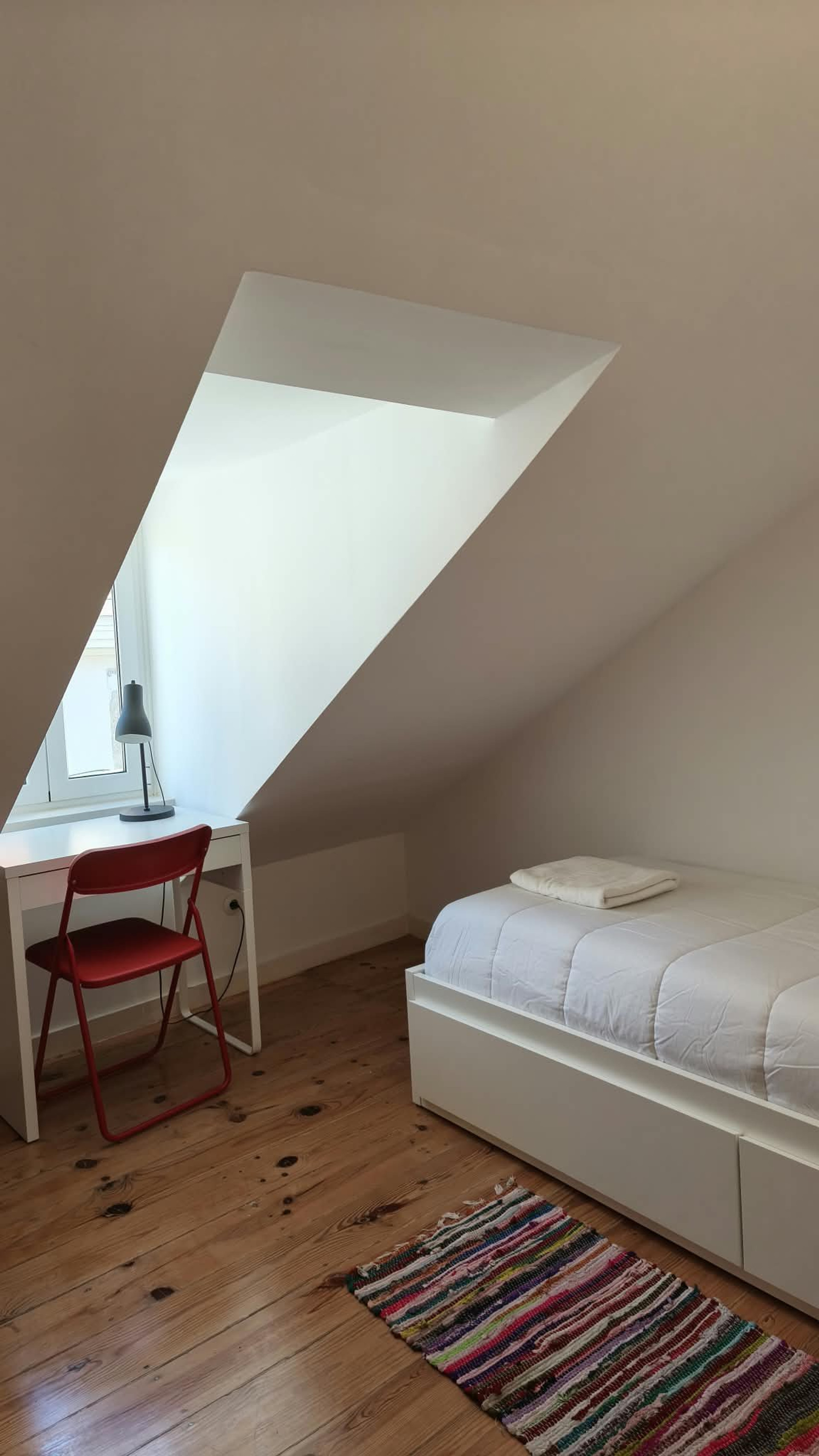 Cozy loft bedroom with study desk