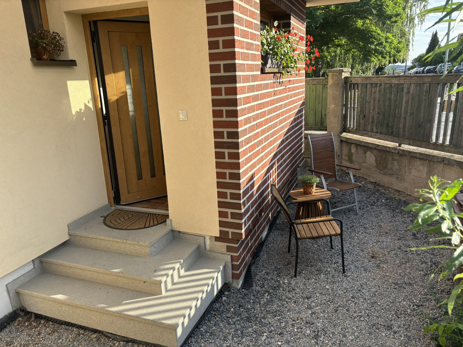Main entrance door and outside seating.