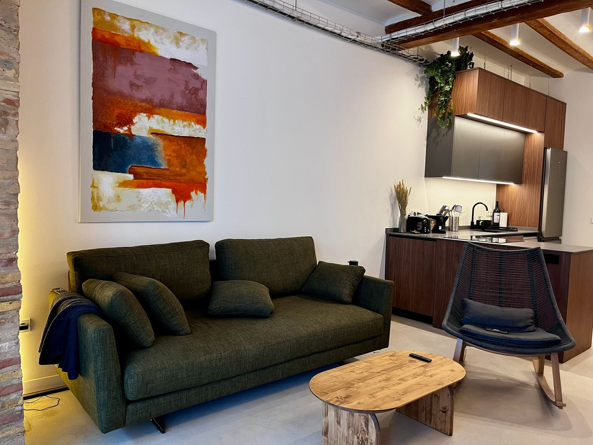 Living room with green sofa