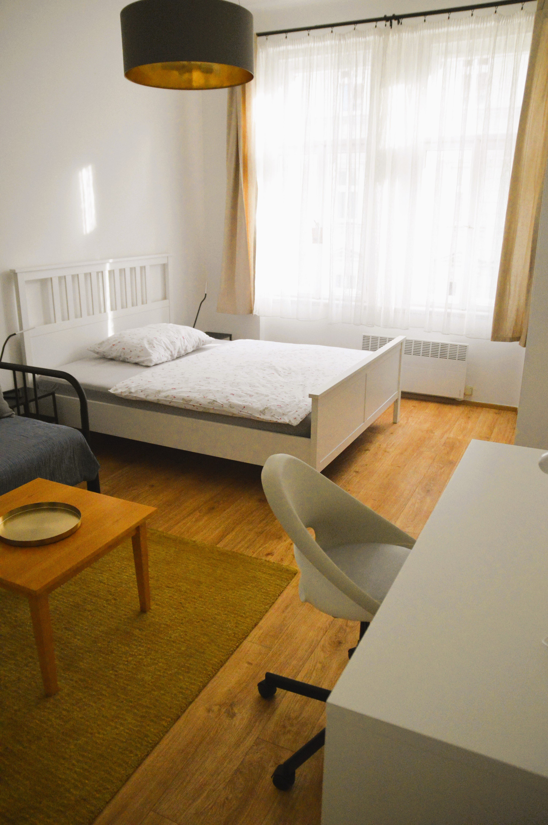Bedroom with desk and bed