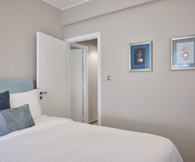 The second's bedroom with a queen size bed