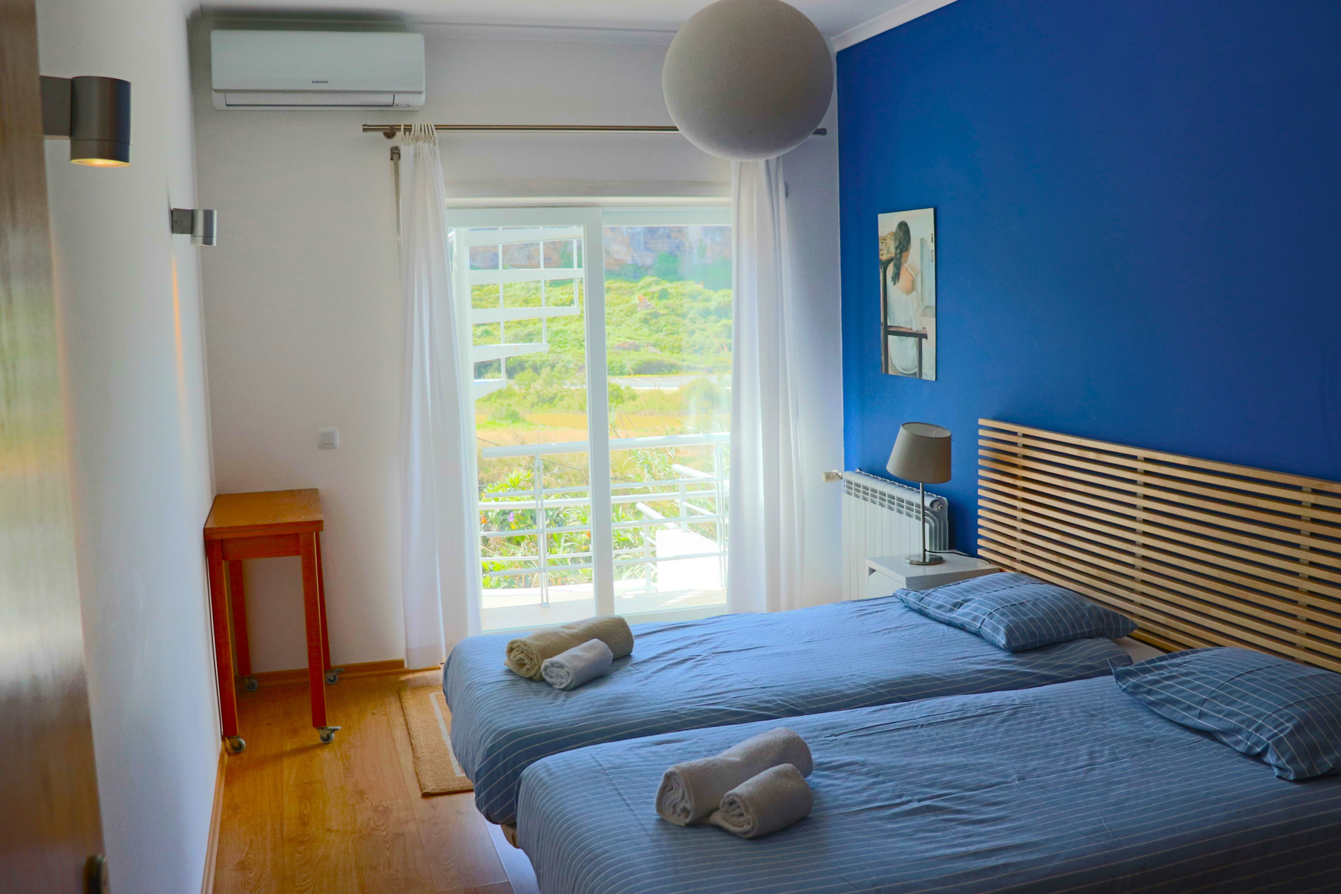 Twin bedroom with balcony access