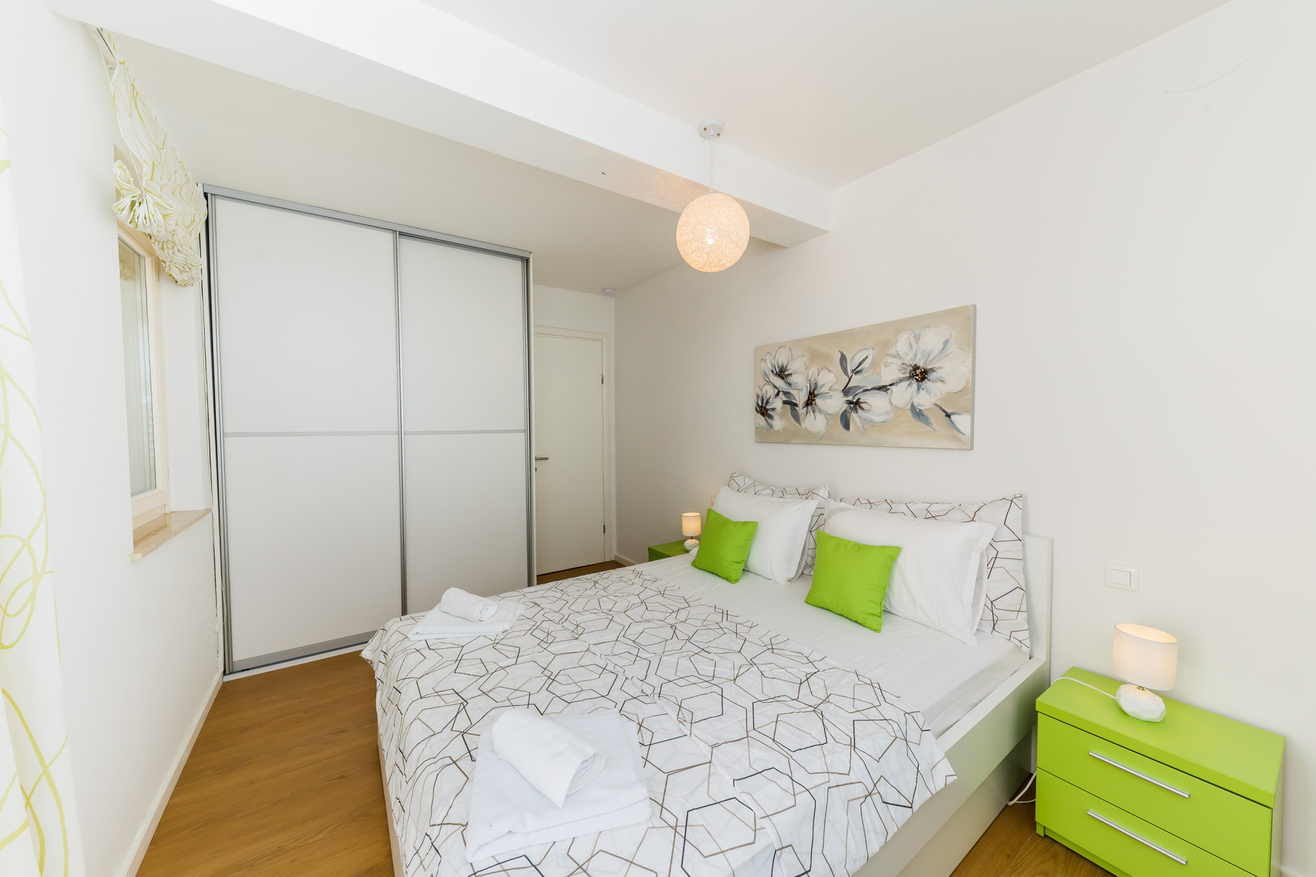 bedroom with balcony and beach view
