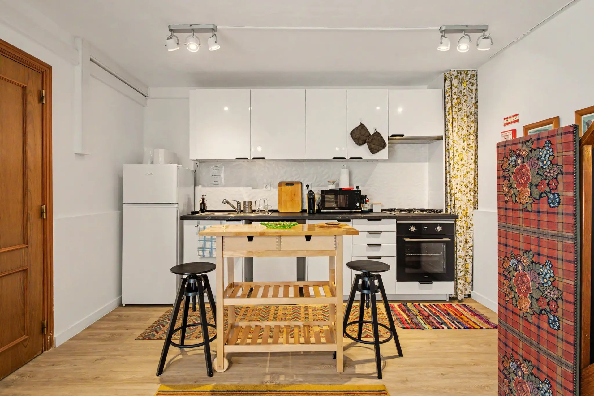 Kitchen with island and bar stools