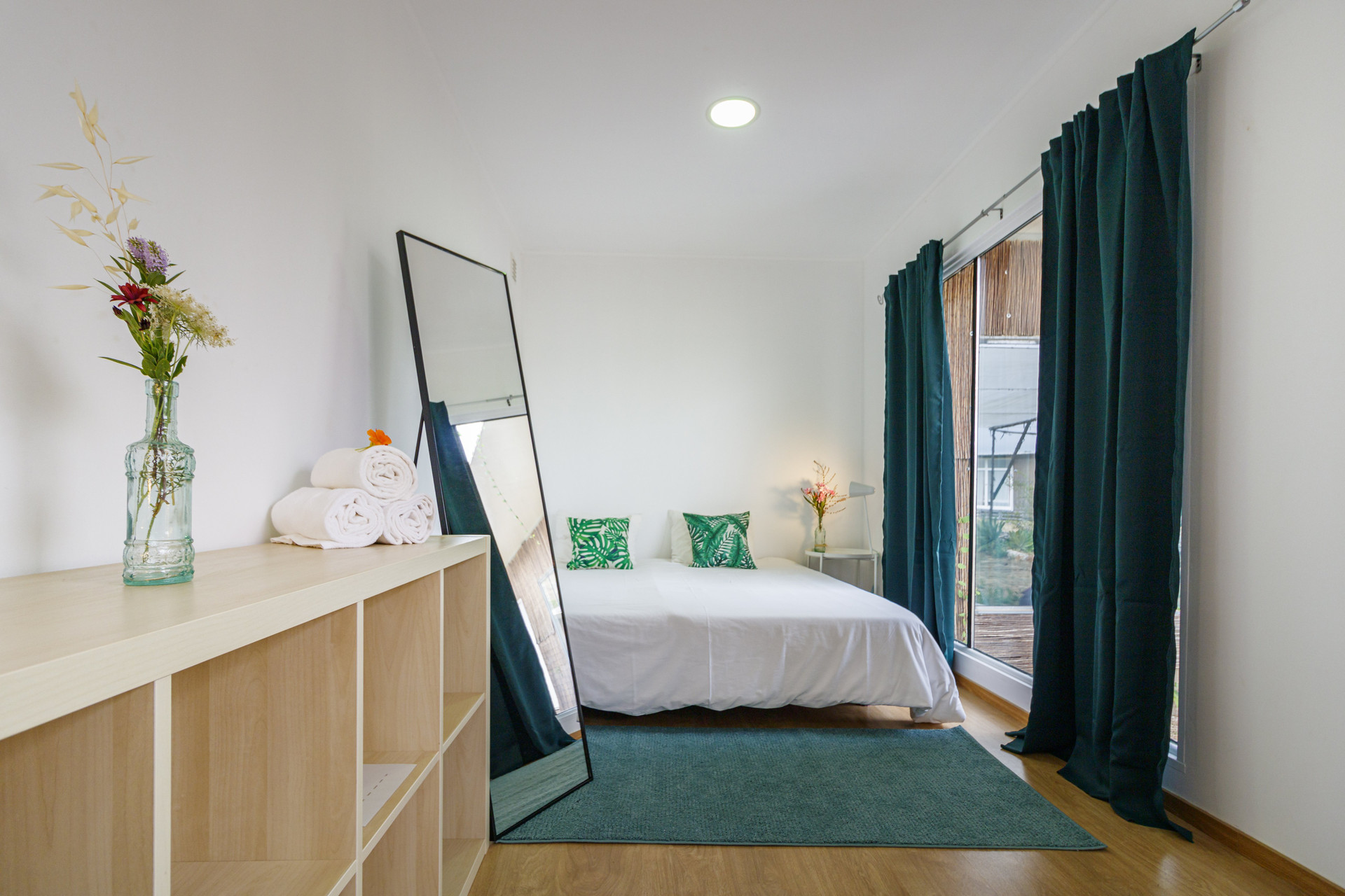 Bright double bedroom with mirror