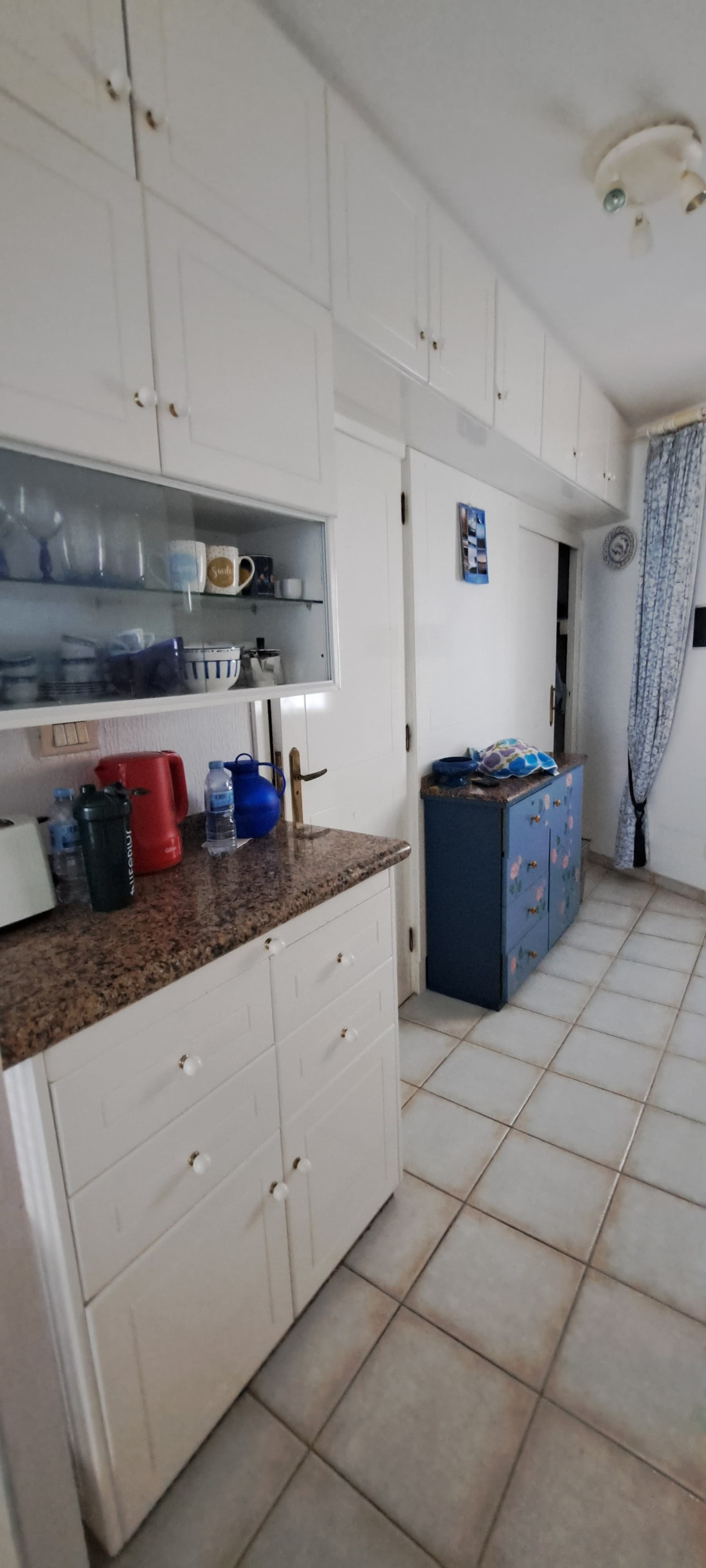 Kitchen area with dresser and cabinets
