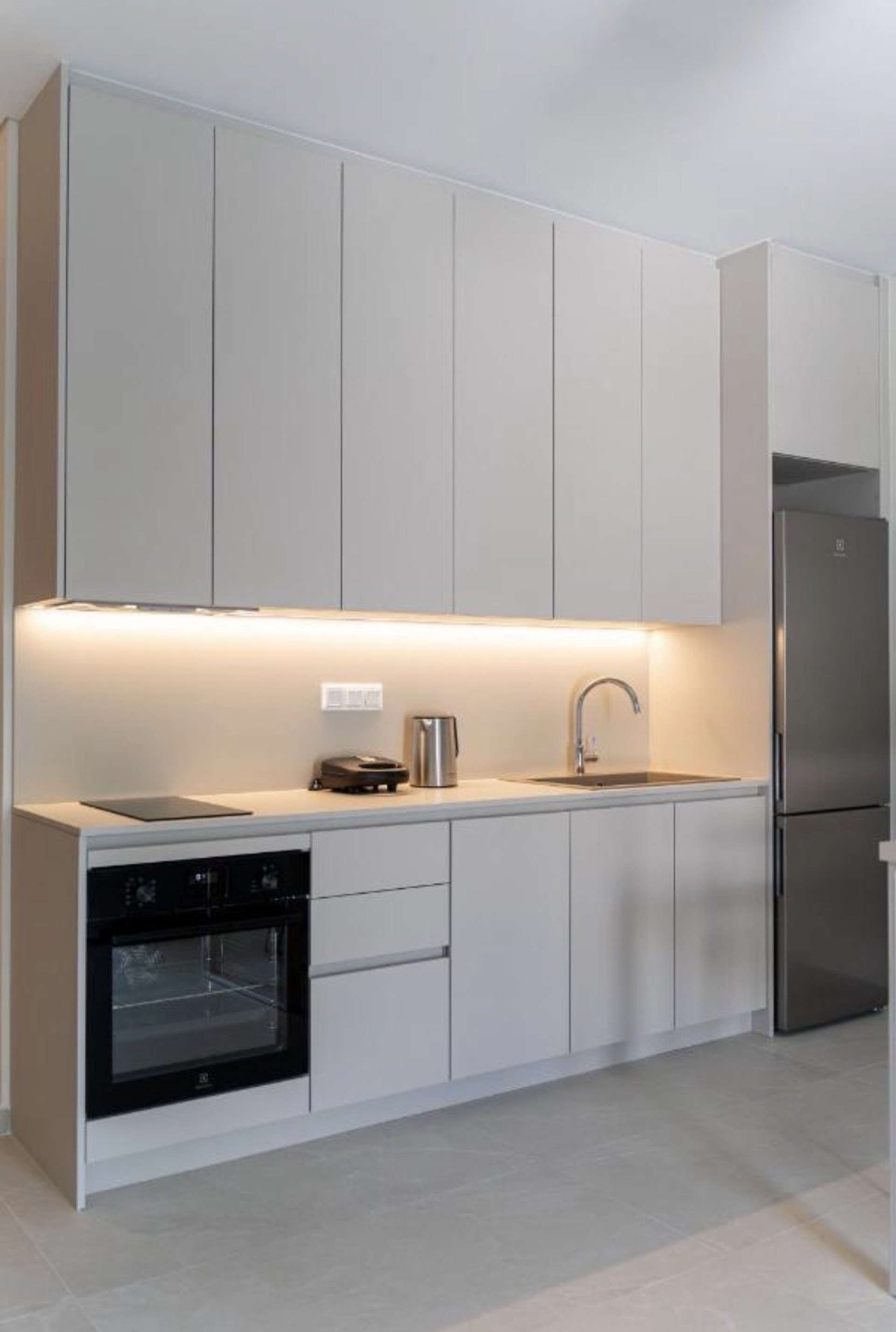 Modern white kitchen with LED lighting